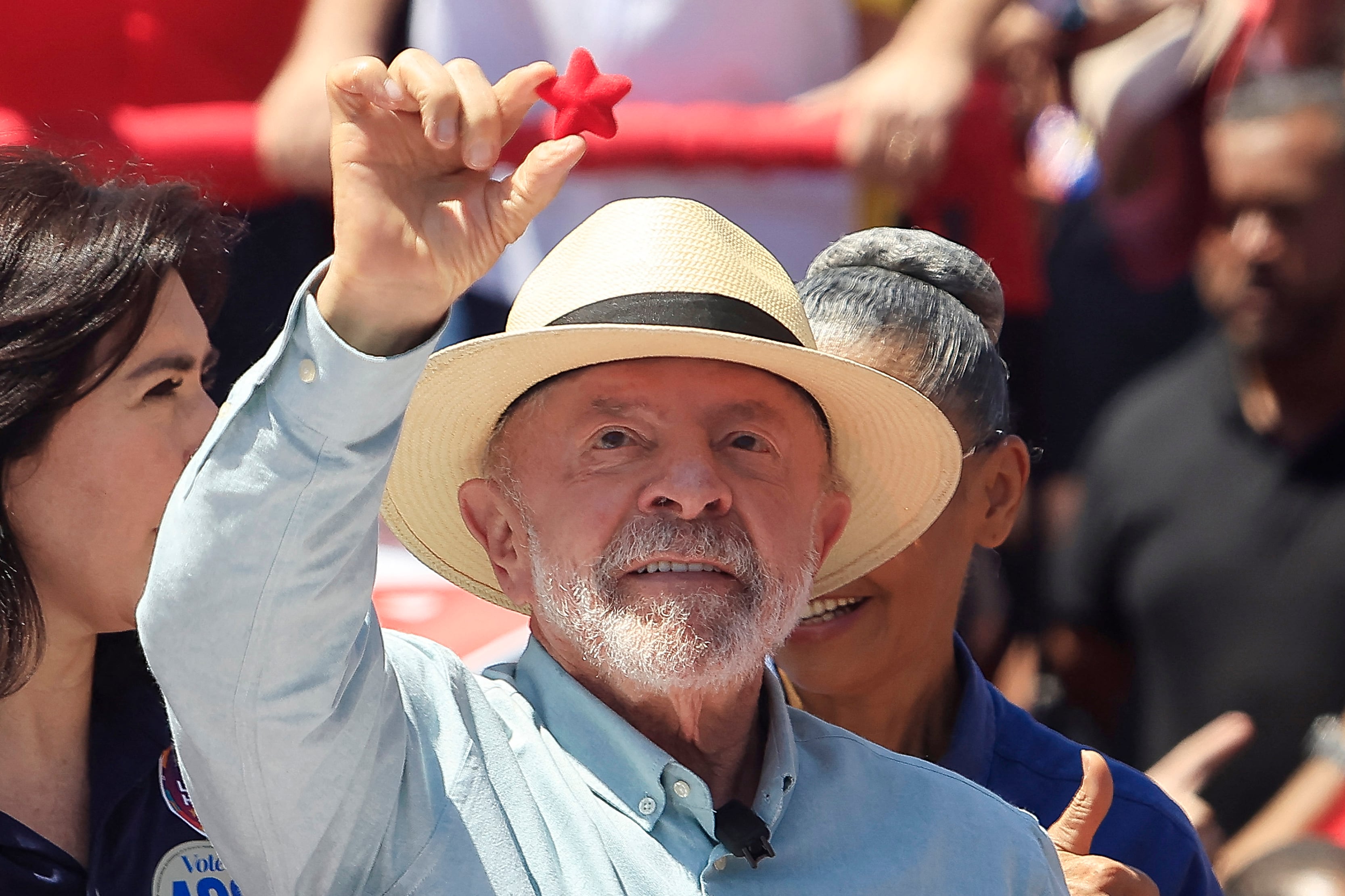 Brazil's President and presidential candidate Luiz Inacio Lula da Silva holds a red star  during a campaign rally at the Sao Miguel Paulista neighbourhood in Sao Paulo, Brazil, on September 26