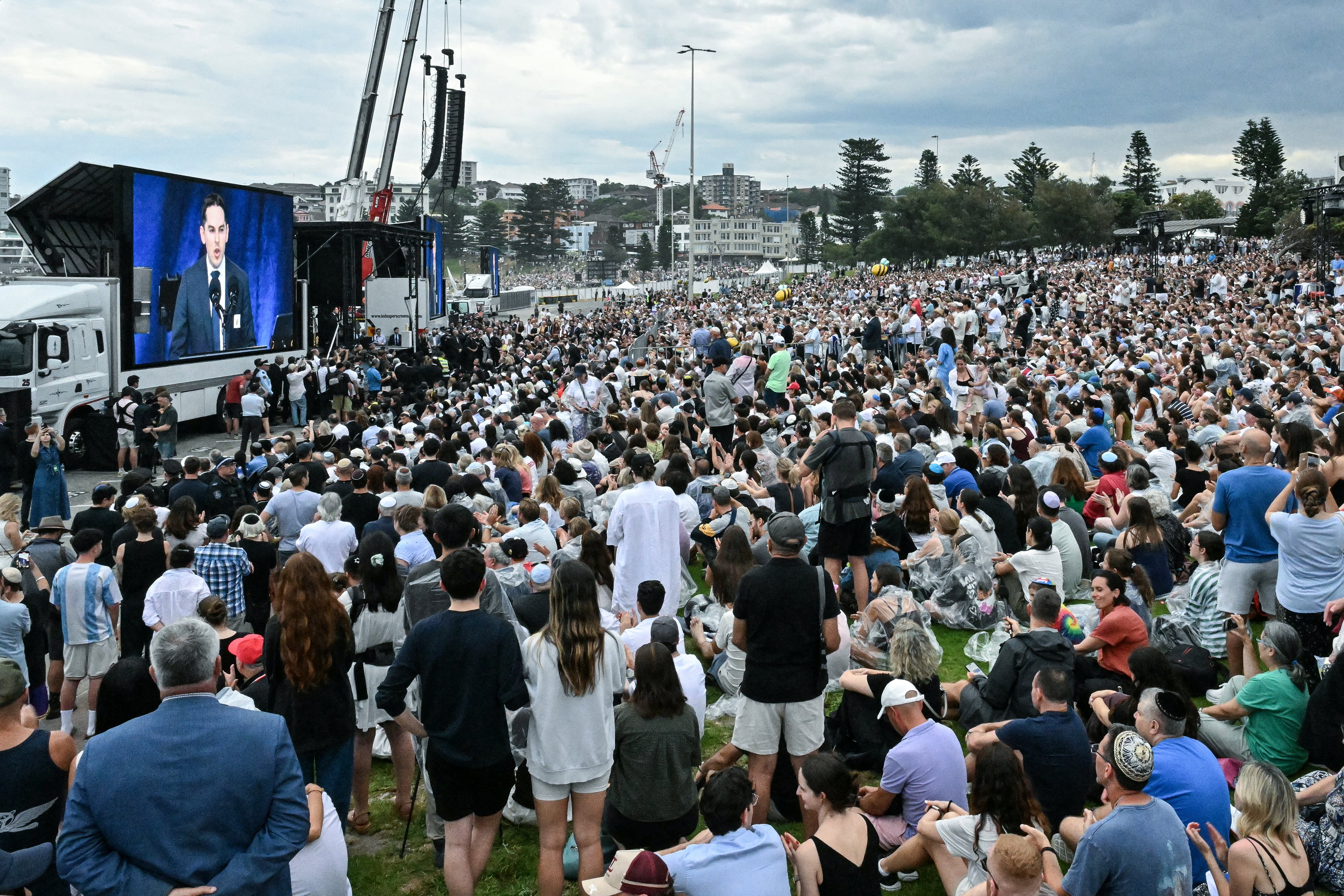 Mourners attend the memorial held for the victims of a shooting at Bondi Beach in Sydney on December 21, 2025. A father and his son are accused of spraying bullets into the family-thronged Hanukkah celebration at Sydney's most famous beach on December 14, allegedly inspired by "Islamic State ideology". (Photo by Saeed KHAN / AFP)