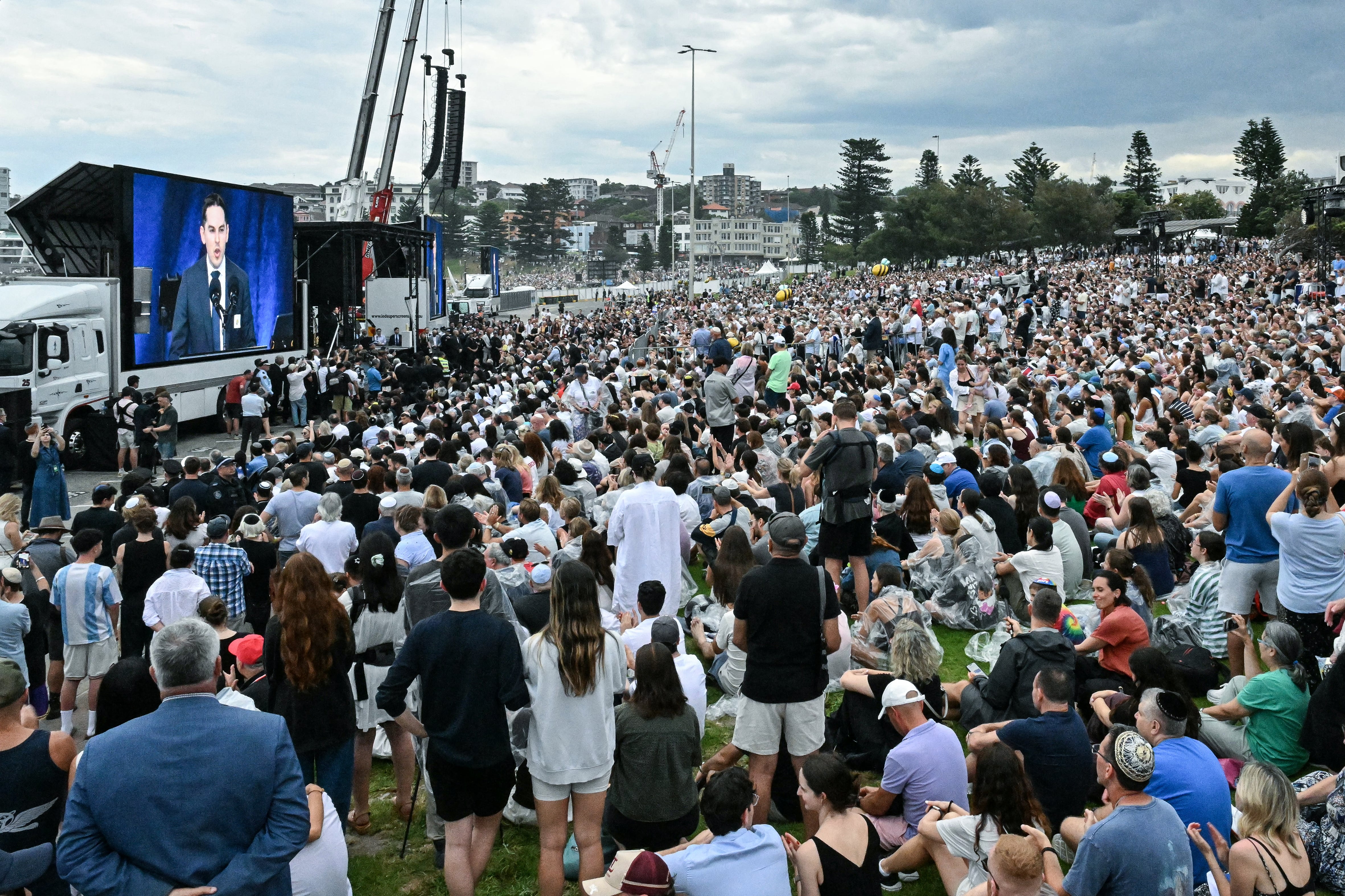 Mourners attend the memorial held for the victims of a shooting at Bondi Beach in Sydney on December 21, 2025. A father and his son are accused of spraying bullets into the family-thronged Hanukkah celebration at Sydney's most famous beach on December 14, allegedly inspired by "Islamic State ideology". (Photo by Saeed KHAN / AFP)