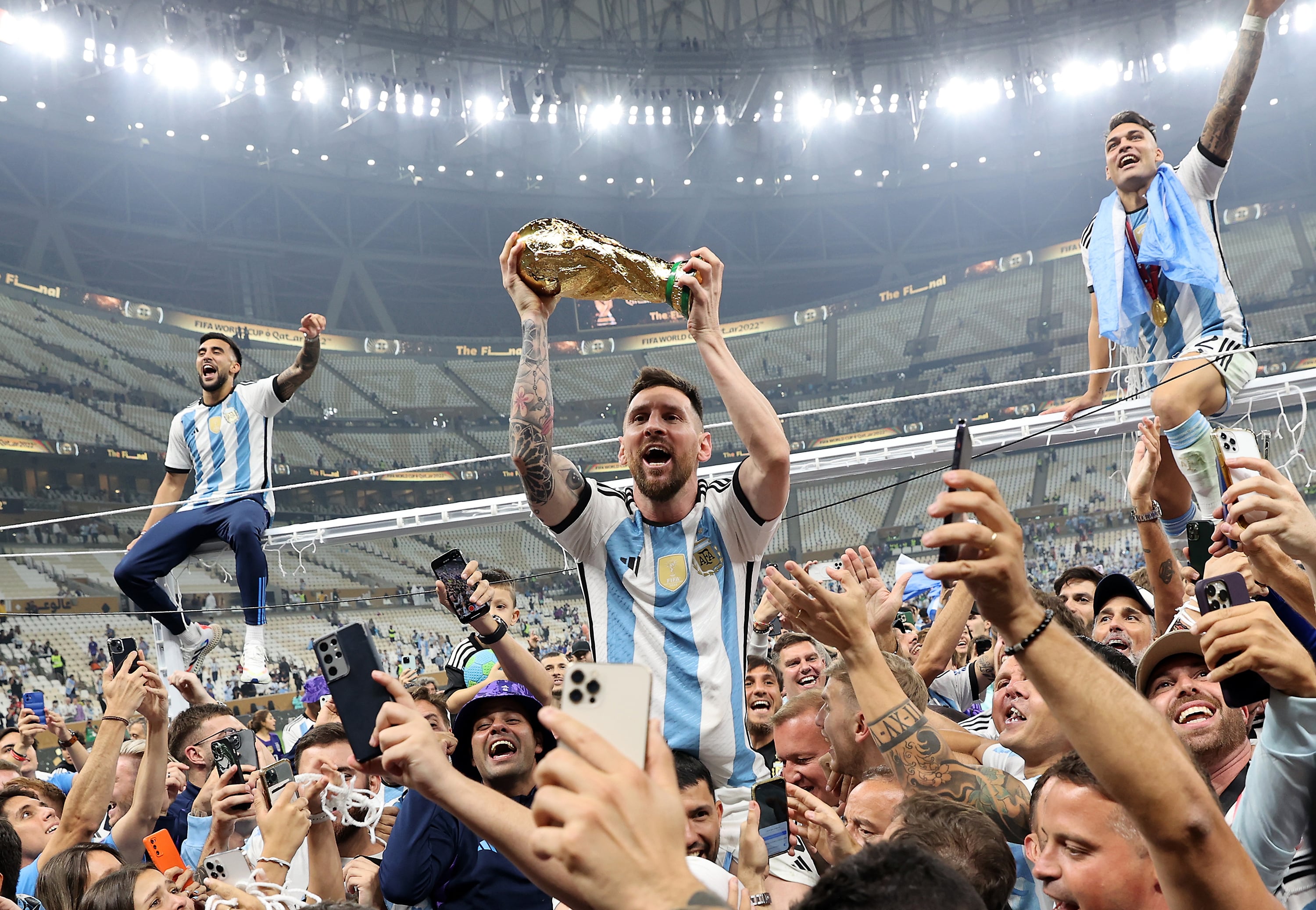 Qatar), 31/08/2026.- (FILE) - Lionel Messi of Argentina (C) lifts the trophy as he celebrates with teammates and fans winning the FIFA World Cup 2022 Final between Argentina and France at Lusail stadium, Lusail, Qatar, 18 December 2022 (Reissued 31 August 2026). Lionel Messi announed his retirement from international soccer on 31 August 2026