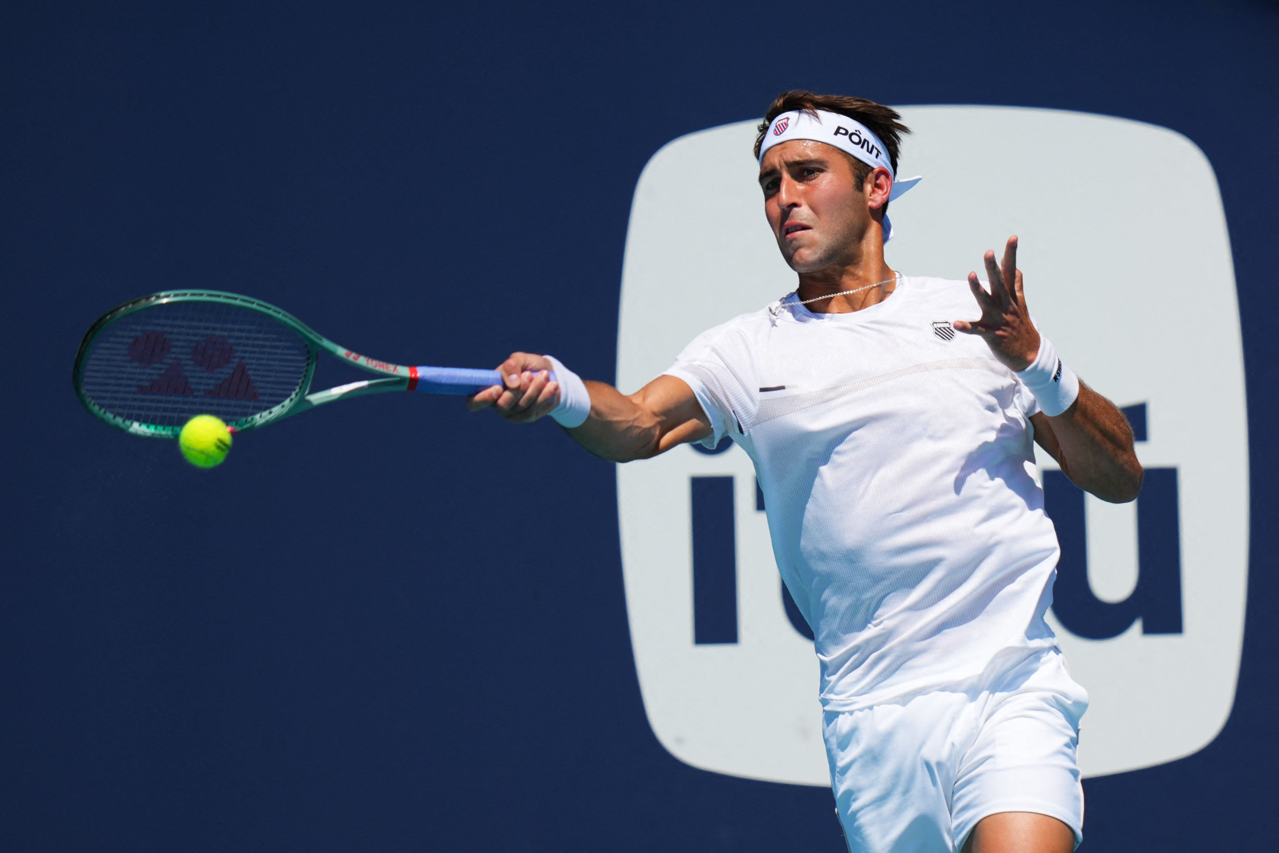MIAMI GARDENS, FLORIDA - MARCH 22: Tomas Martin Etcheverry of Argentina returns a shot against Rafael Jodar of Spain during Day 6 of the Miami Open at Hard Rock Stadium on March 22, 2026 in Miami Gardens, Florida.   Rich Storry/Getty Images/AFP (Photo by Rich Storry / GETTY IMAGES NORTH AMERICA / Getty Images via AFP)
