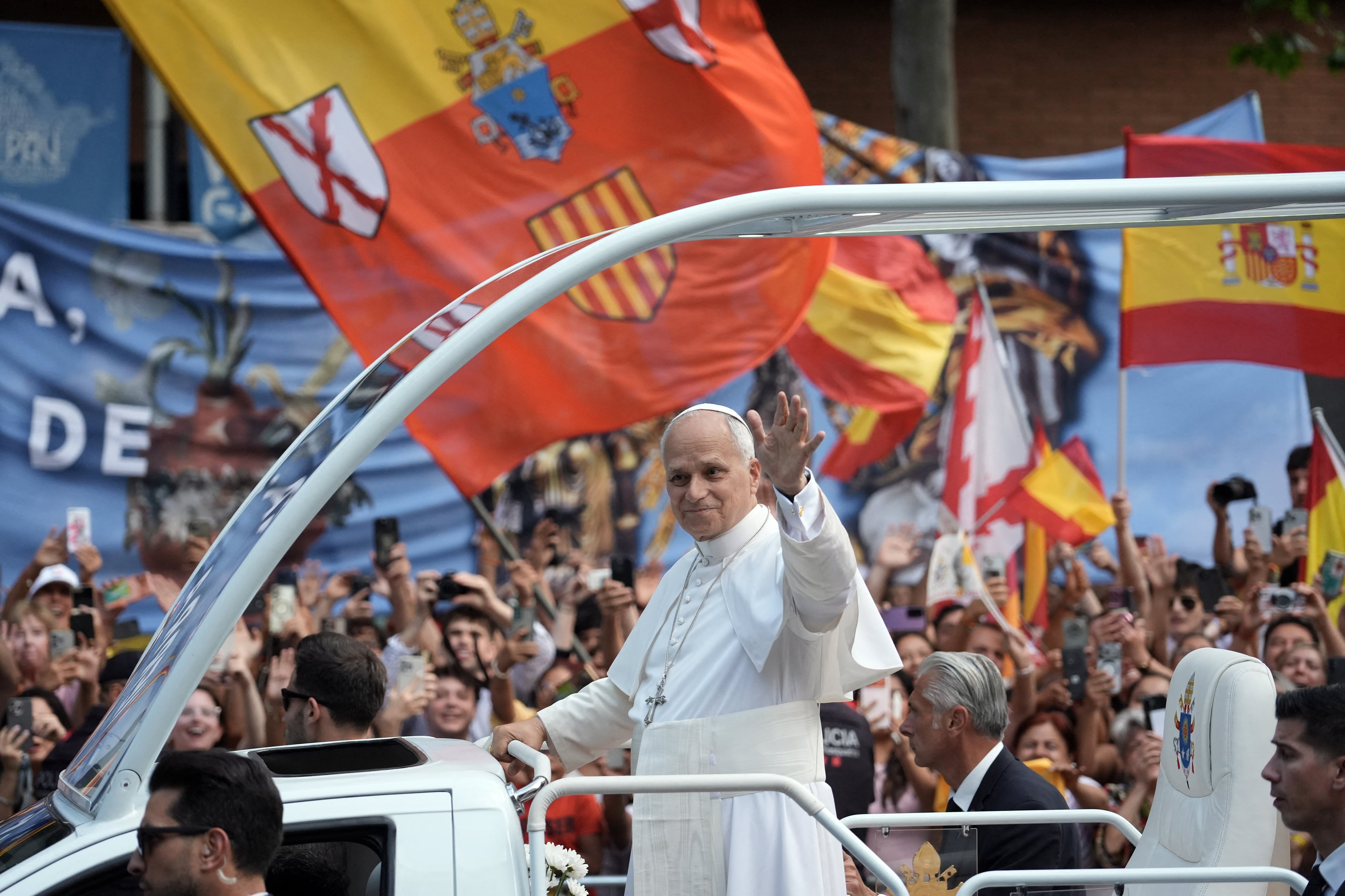 Pope Leo XIV waves as he arrives to lead Holy Mass in the Basilica of the Sagrada Familia and inauguration of the Jesus Christ tower in Barcelona, on June 10, 2026. Pope Leo XIV is visiting Spain June 6-12 with stops in Madrid, Barcelona, and the Canary Islands, where he will meet with migrants and organisations dedicated to helping them. (Photo by Manaure QUINTERO / AFP)