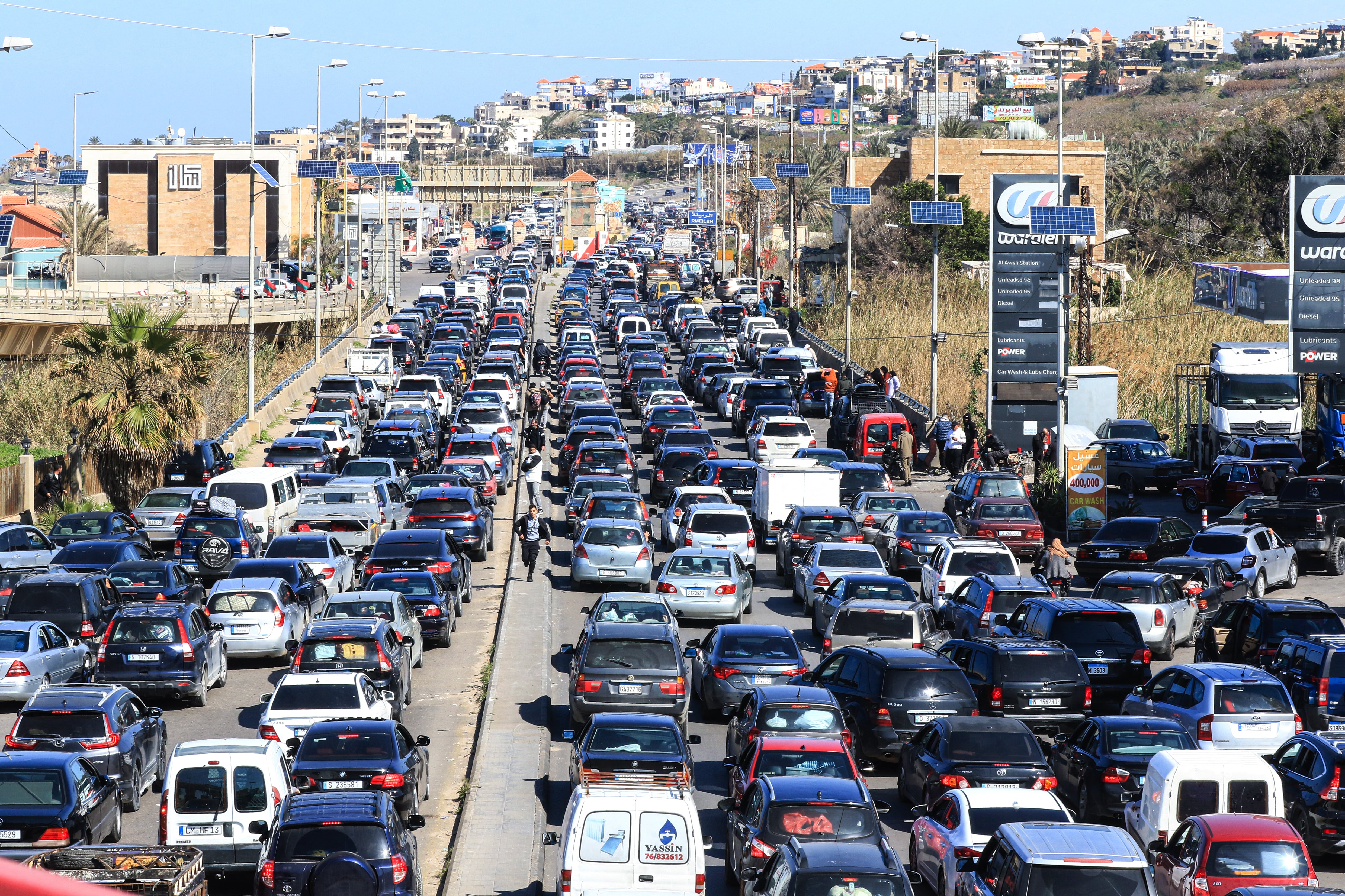 Motorists block the highway as they flee their villages in southern Lebanon along the coastal road through the city of Sidon on March 2, 2026. Israel bombarded Lebanon on March 2, expanding conflict across the region after the massive Israel-US attack on Iran that the US president to topple Tehran's ruling clerics. (Photo by Mahmoud ZAYYAT / AFP)