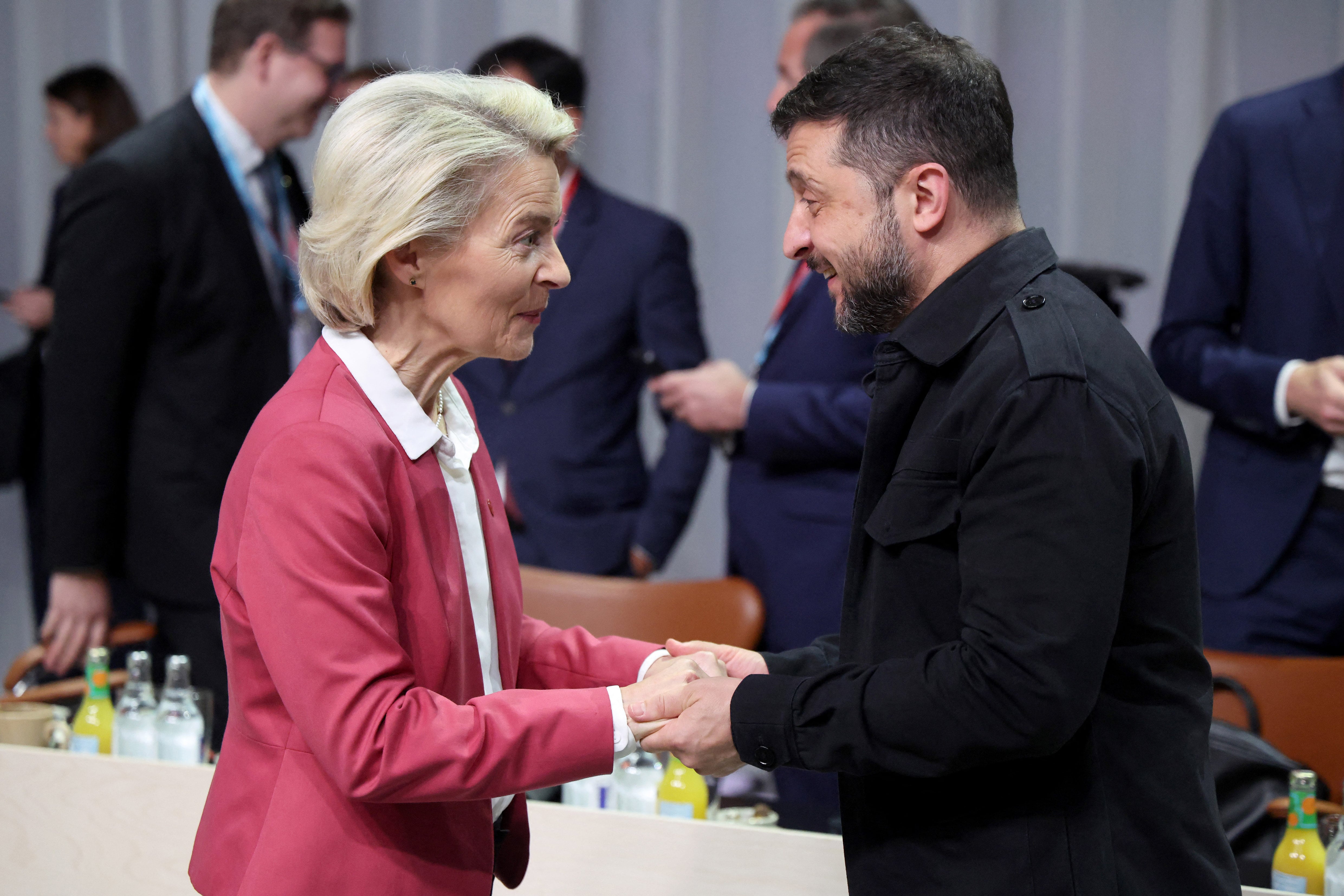 European Commission President Ursula Von der Leyen (L) and Ukraine's President Volodymyr Zelensky greet eachothers as they arrive for a working session of the 7th European Political Community (EPC) Summit at the Bella Center in Copenhagen on October 2, 2025. (Photo by Ludovic MARIN / AFP)