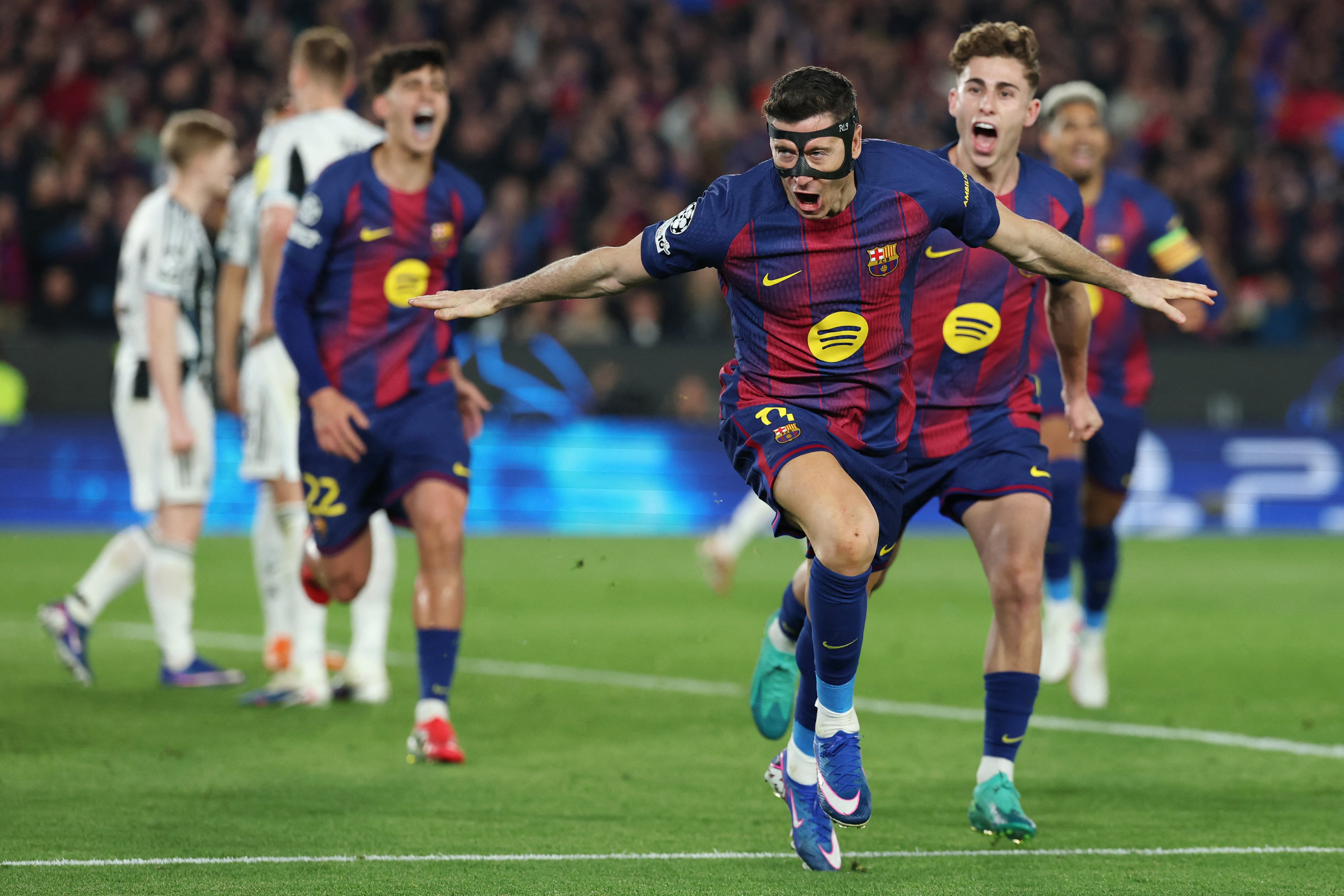 Barcelona's Polish forward #09 Robert Lewandowski celebrates scoring his team's fifth goal during the UEFA Champions League last 16 second leg football match between FC Barcelona and Newcastle United at the Camp Nou stadium in Barcelona, on March 18, 2026. (Photo by Lluis GENE / AFP)