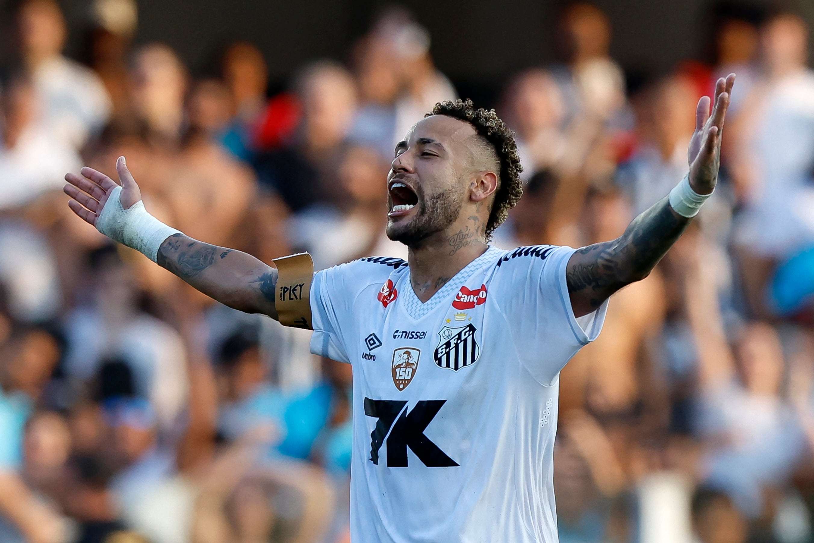 Santos' forward #10 Neymar celebrates at the end of the Brasileirao Serie A football match between Santos and Cruzeiro at the Urbano Caldeira Stadium in Santos, Sao Paulo state, Brazil on December 7, 2025. (Photo by Miguel Schincariol / AFP)