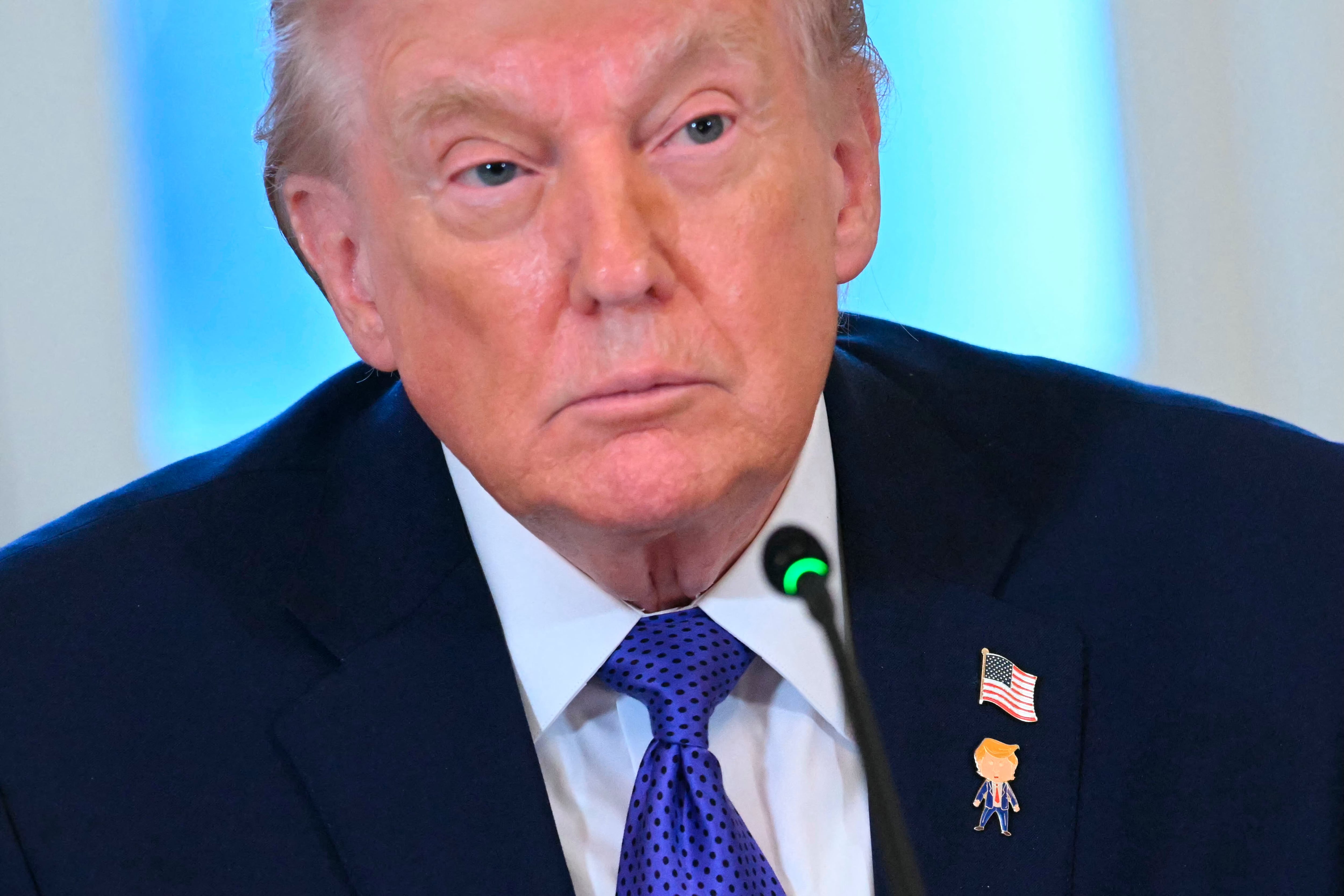 US President Donald Trump looks on during a meeting with US oil companies executives in the East Room of the White House in Washington, DC on January 9, 2026. President Trump is aiming to convince oil executives to support his plans in Venezuela, a country whose energy resources he says he expects to control for years to come. US forces seized Venezuelan president Nicolas Maduro in a sweeping military operation on January 3, with Trump making no secret that control of Venezuela's oil was at the heart of his actions. (Photo by SAUL LOEB / AFP)