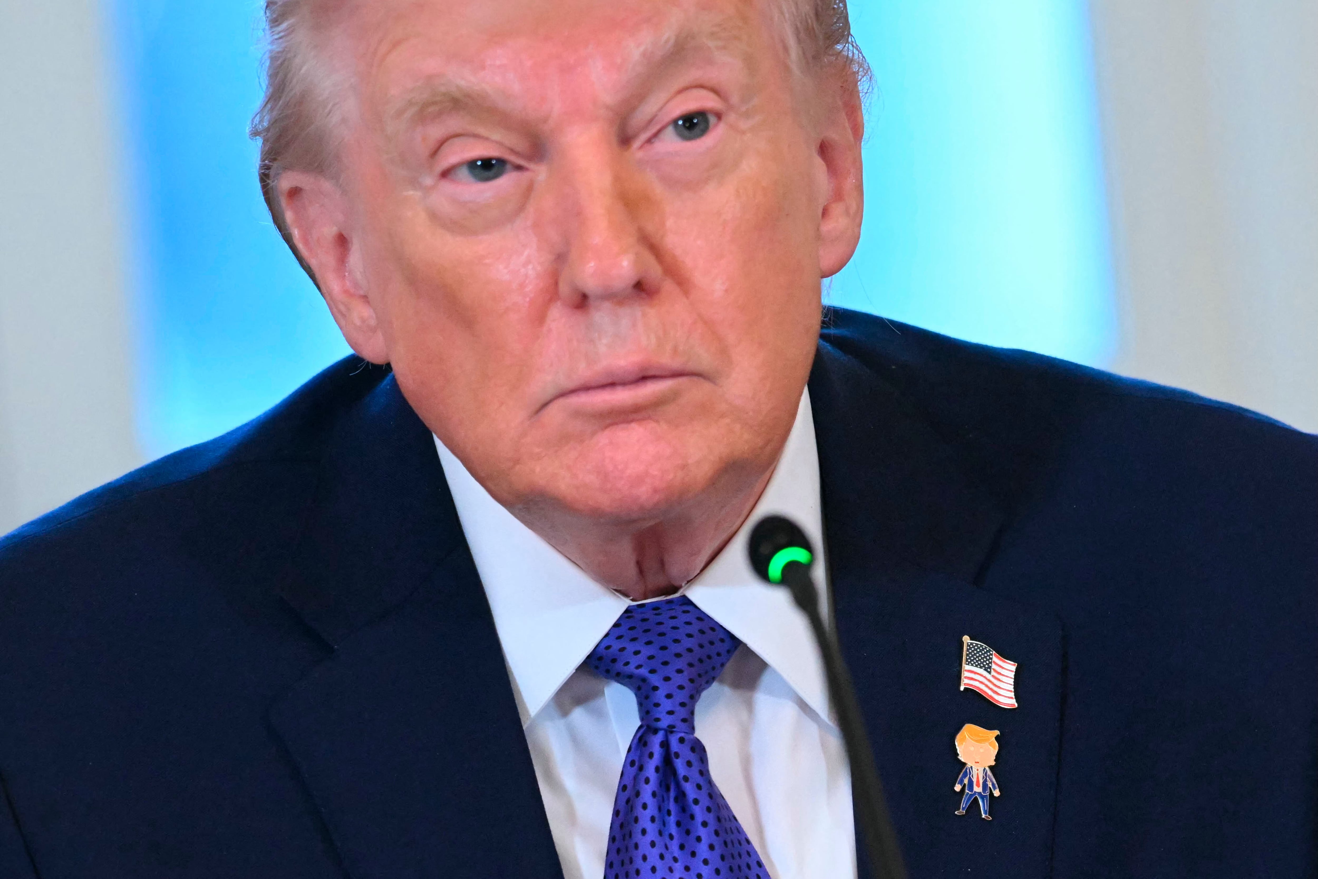 US President Donald Trump looks on during a meeting with US oil companies executives in the East Room of the White House in Washington, DC on January 9, 2026. President Trump is aiming to convince oil executives to support his plans in Venezuela, a country whose energy resources he says he expects to control for years to come. US forces seized Venezuelan president Nicolas Maduro in a sweeping military operation on January 3, with Trump making no secret that control of Venezuela's oil was at the heart of his actions. (Photo by SAUL LOEB / AFP)