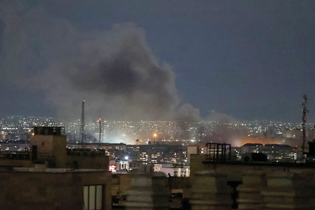 A plume of smoke rises from the site of a strike in Tehran late on March 28, 2026. Israel and the United States launched strikes on Iran on February 28