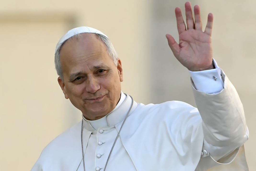 Pope Leo XIV waves to the crowd during the weekly general audience at St Peter's Square in The Vatican on March 18, 2026. (Photo by Andreas SOLARO / AFP)