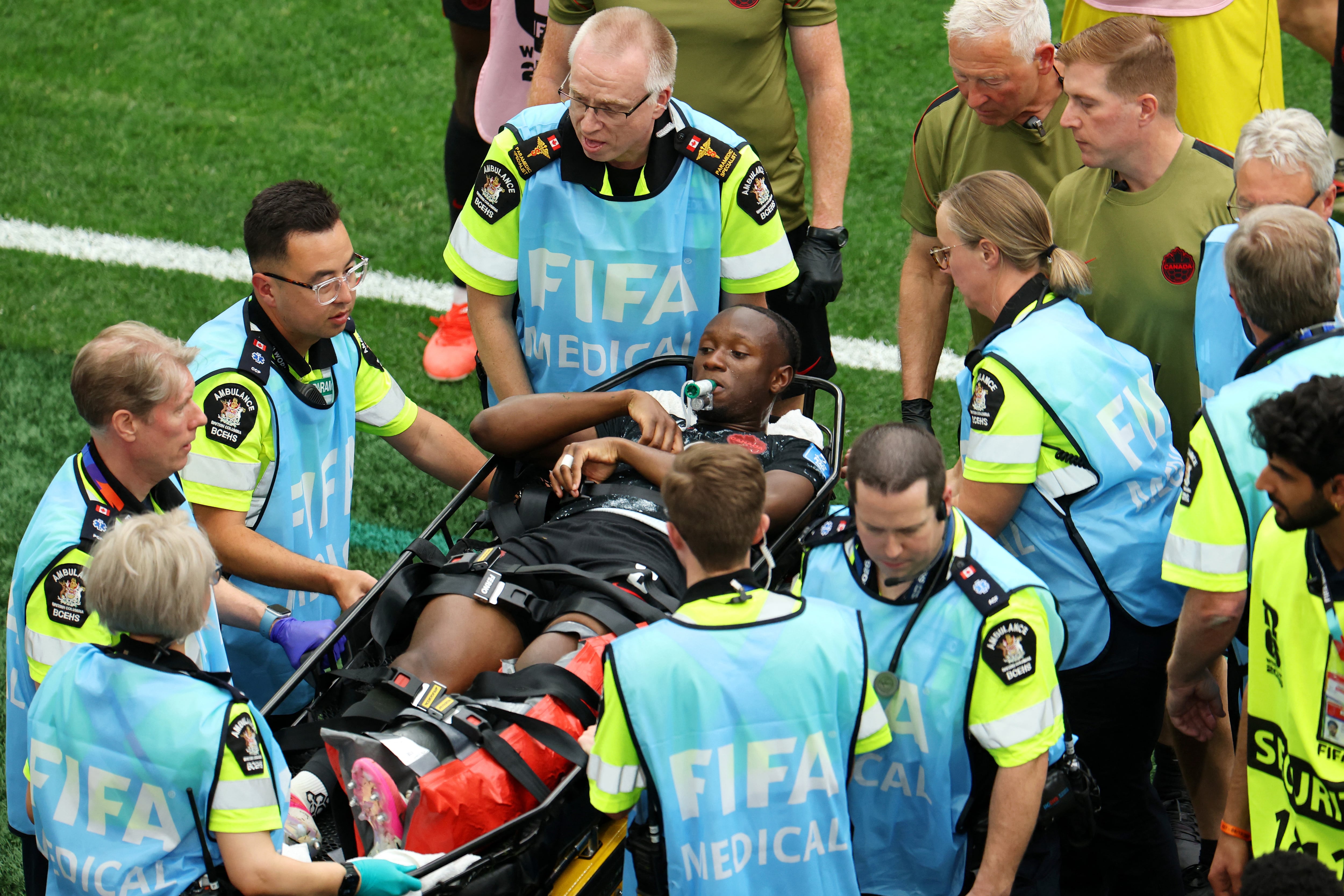 VANCOUVER, BRITISH COLUMBIA - JUNE 18: Ismael Kone #8 of Canada is stretched off after being fouled by Assim Madibo #23 of Qatar during the FIFA World Cup 2026 Group B match between Canada and Qatar at BC Place Vancouver on June 18, 2026 in Vancouver, British Columbia. Emilee Chinn/Getty Images/AFP (Photo by Emilee Chinn / GETTY IMAGES NORTH AMERICA / Getty Images via AFP)