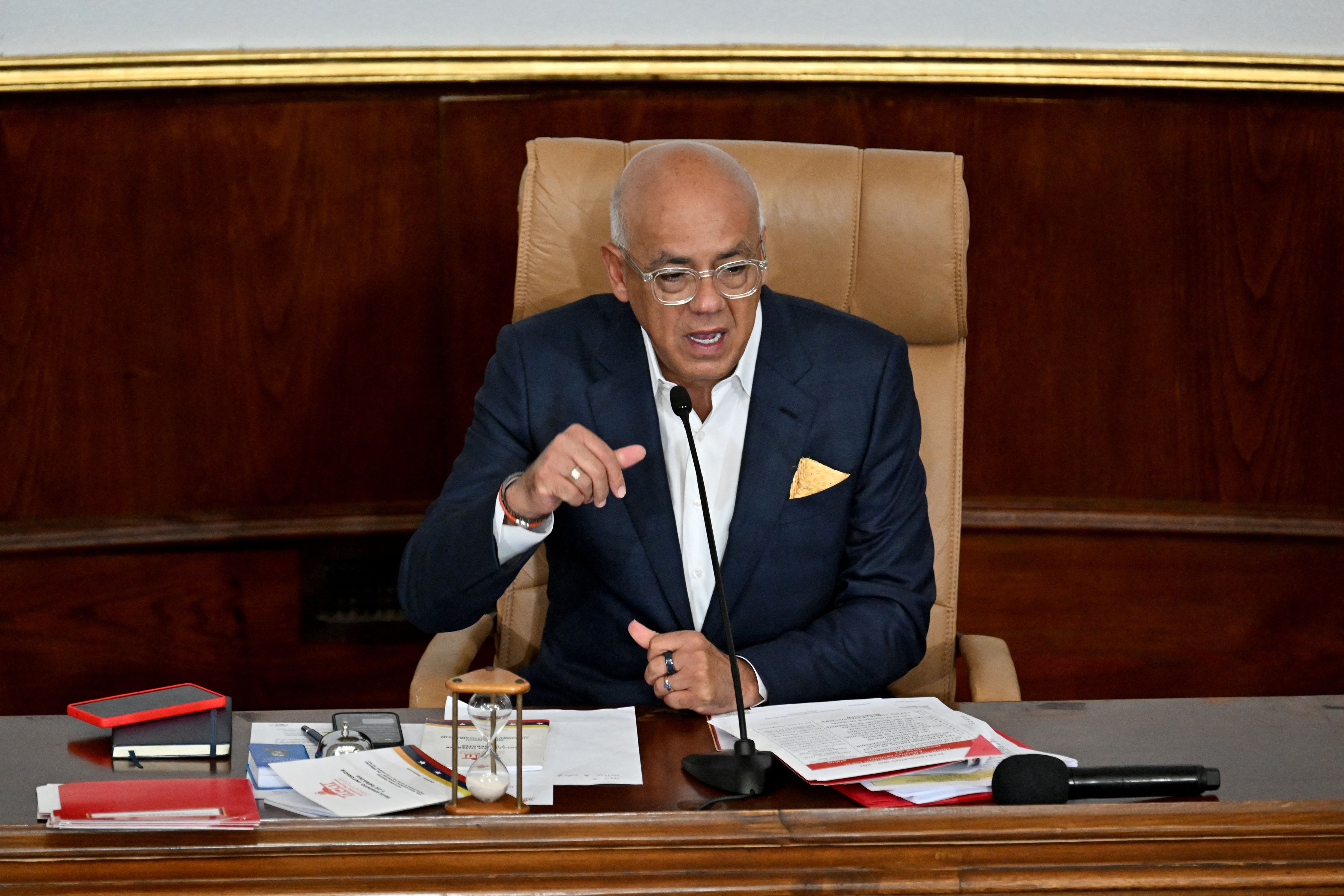 Venezuela's President of the National Assembly Jorge Rodriguez conducts a plenary session at the National Assembly in Caracas on January 22, 2026. Venezuela's parliament on January 22 begins debating plans to throw open the country's lucrative oil sector to private investment, less than three weeks after the US ouster of Nicolas Maduro. (Photo by Juan BARRETO / AFP)