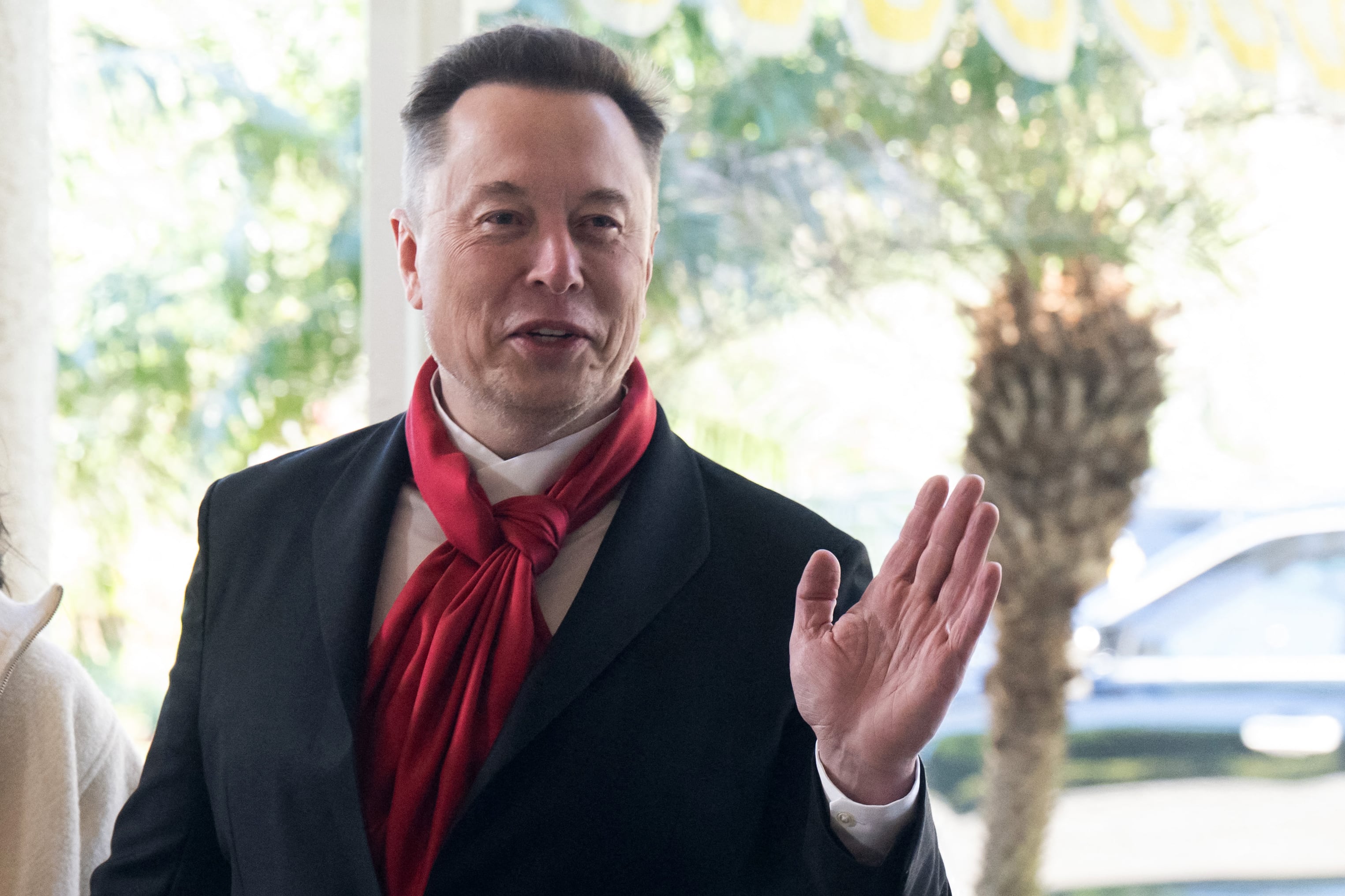 Elon Musk, CEO of Tesla and SpaceX, and Shivon Zilis, a venture capitalist, arrive to attend the wedding of Dan Scavino, White House Deputy Chief of Staff, and Erin Elmore, the Department of State Director of Art in Embassies, at Mar-a-Lago in Palm Beach, Florida, February 1, 2026. (Photo by SAUL LOEB / AFP)