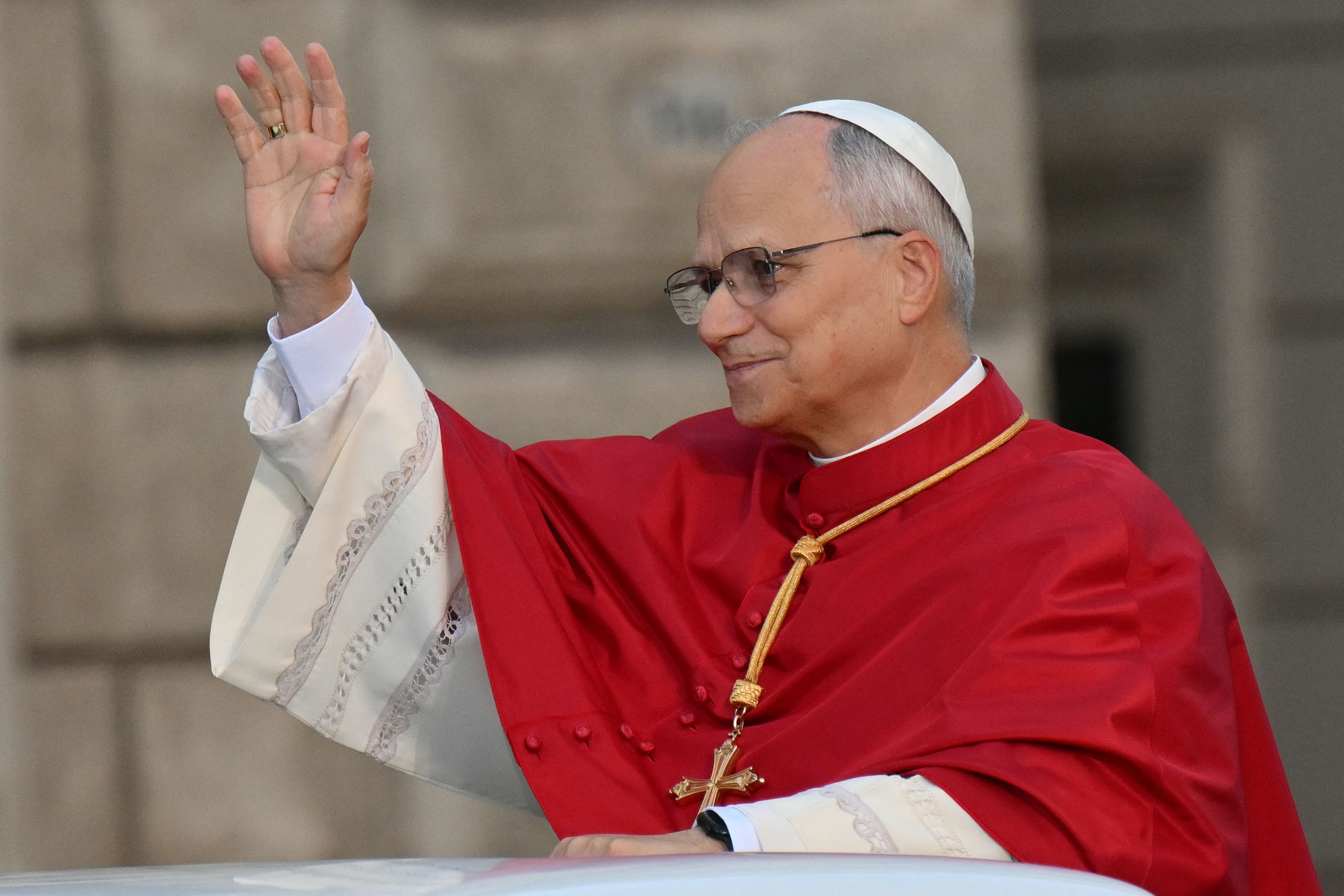 Pope Leo XIV waves to the crowd as he arrives to pay homage to the Immaculate Conception, near the Spanish steps in Rome, on December 8, 2025. (Photo by Alberto PIZZOLI / AFP)