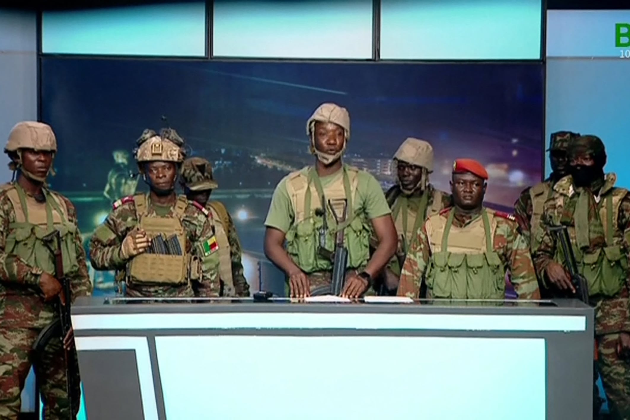 This videograb taken from handout footage released by Benin TV on December 7, 2025, shows soldiers from the "Military Committee for Refoundation" (CMR), appearing on state television in Cotonou, after a reported attempted coup in the West African nation. Benin's government said it had thwarted an attempted coup, after a group of soldiers announced on state television that they had ousted President Patrice Talon. Military and security sources said that around a dozen soldiers were arrested, including those behind the foiled coup (Photo by HANDOUT / BENIN TV / AFP) / RESTRICTED TO EDITORIAL USE - MANDATORY CREDIT "AFP PHOTO / BENINTV / HANDOUT / " - NO MARKETING NO ADVERTISING CAMPAIGNS - DISTRIBUTED AS A SERVICE TO CLIENTS