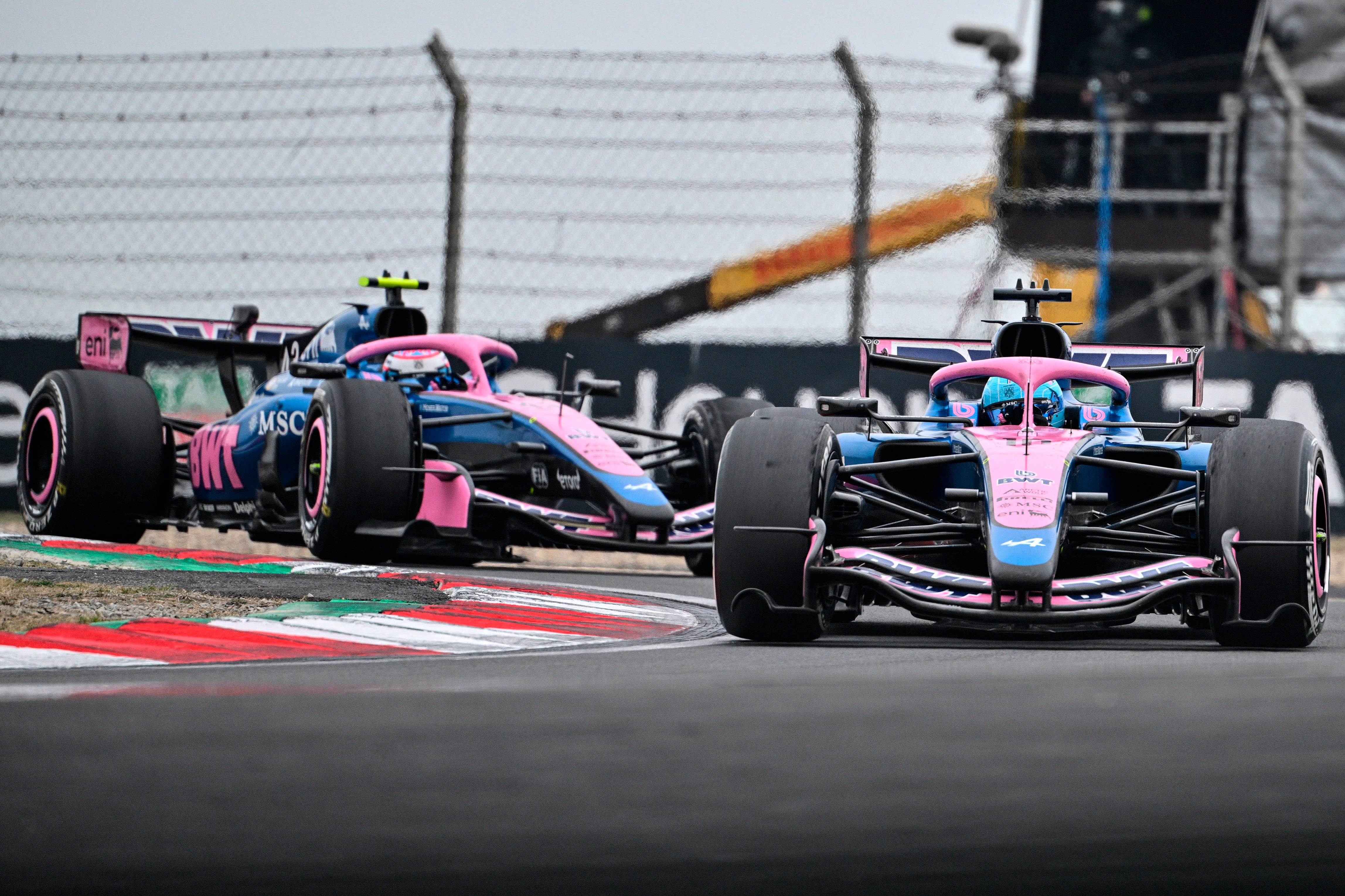 Alpine's French driver Pierre Gasly (R) and Alpine's Argentine driver Franco Colapinto (L) drive during the Formula One Chinese Grand Prix at the Shanghai International Circuit in Shanghai on March 15, 2026. (Photo by Hector RETAMAL / AFP)