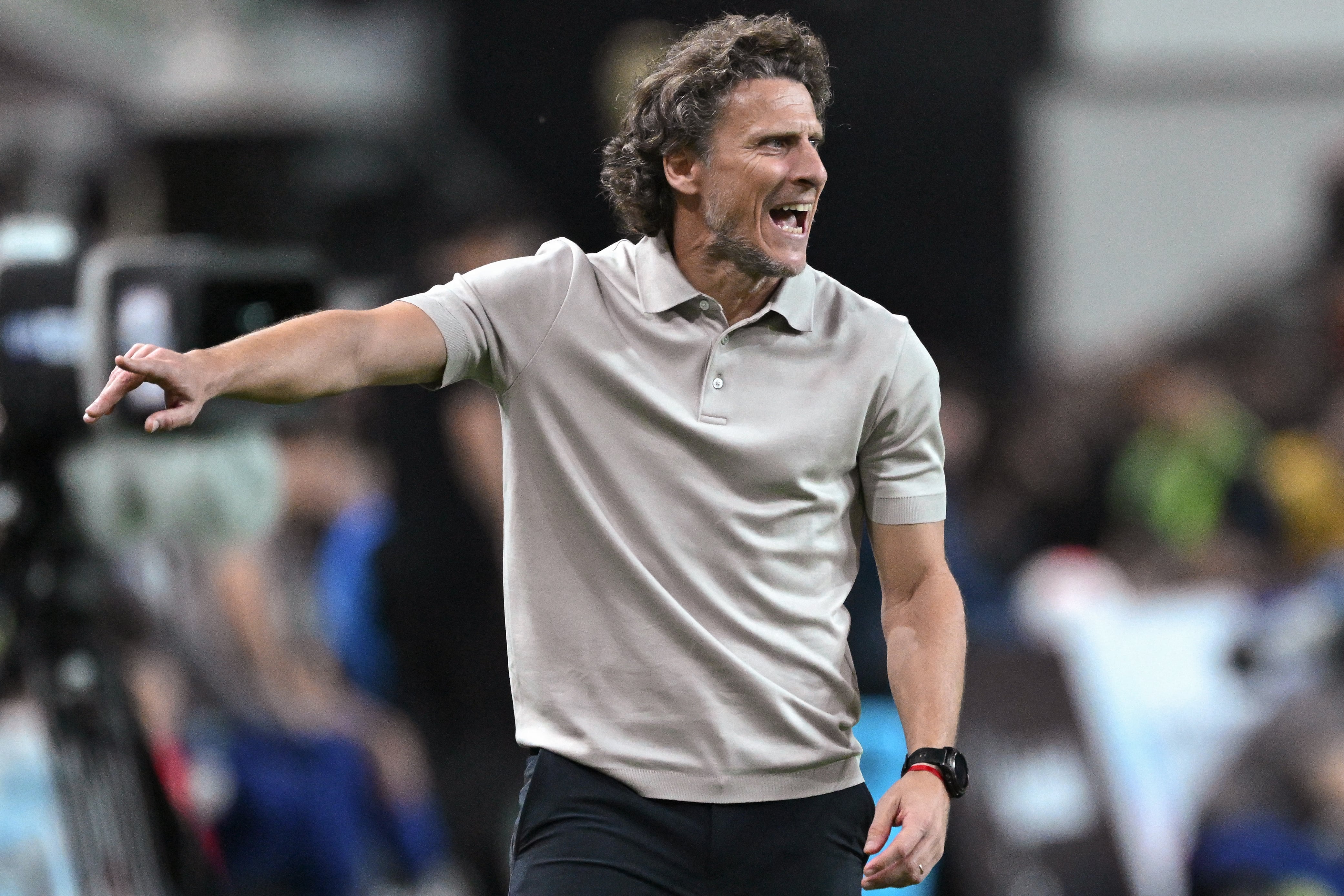 Uruguay's interim head coach Diego Forlan reacts during the friendly football match between South Korea and Uruguay in Seoul on September 28, 2026. (Photo by Jung Yeon-je / AFP)
