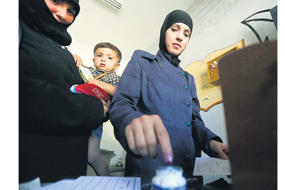 Los domingos son laborables en Siria, lo que en teoría lleva a una baja participación electoral.