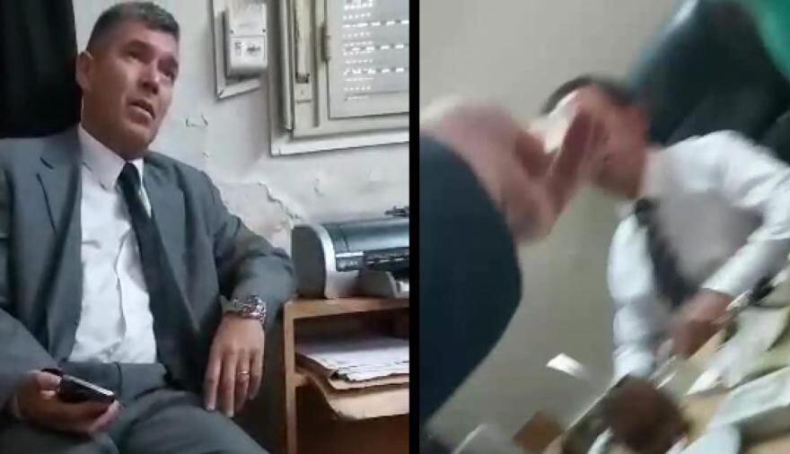 Imágenes del video donde se ve a los camaristas cobrando el dinero.