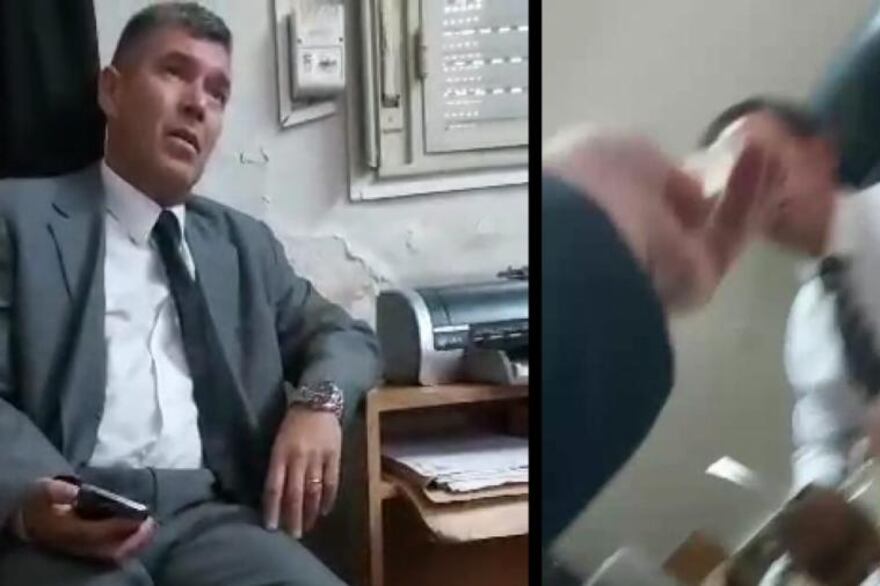 Imágenes del video donde se ve a los camaristas cobrando el dinero.