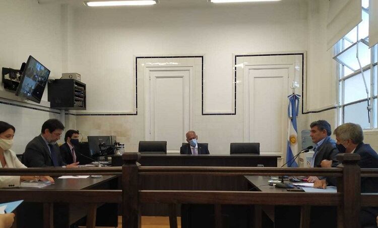 Amad, a la izquierda, y enfrente, el ex diputado macrista Alfredo Olmedo 