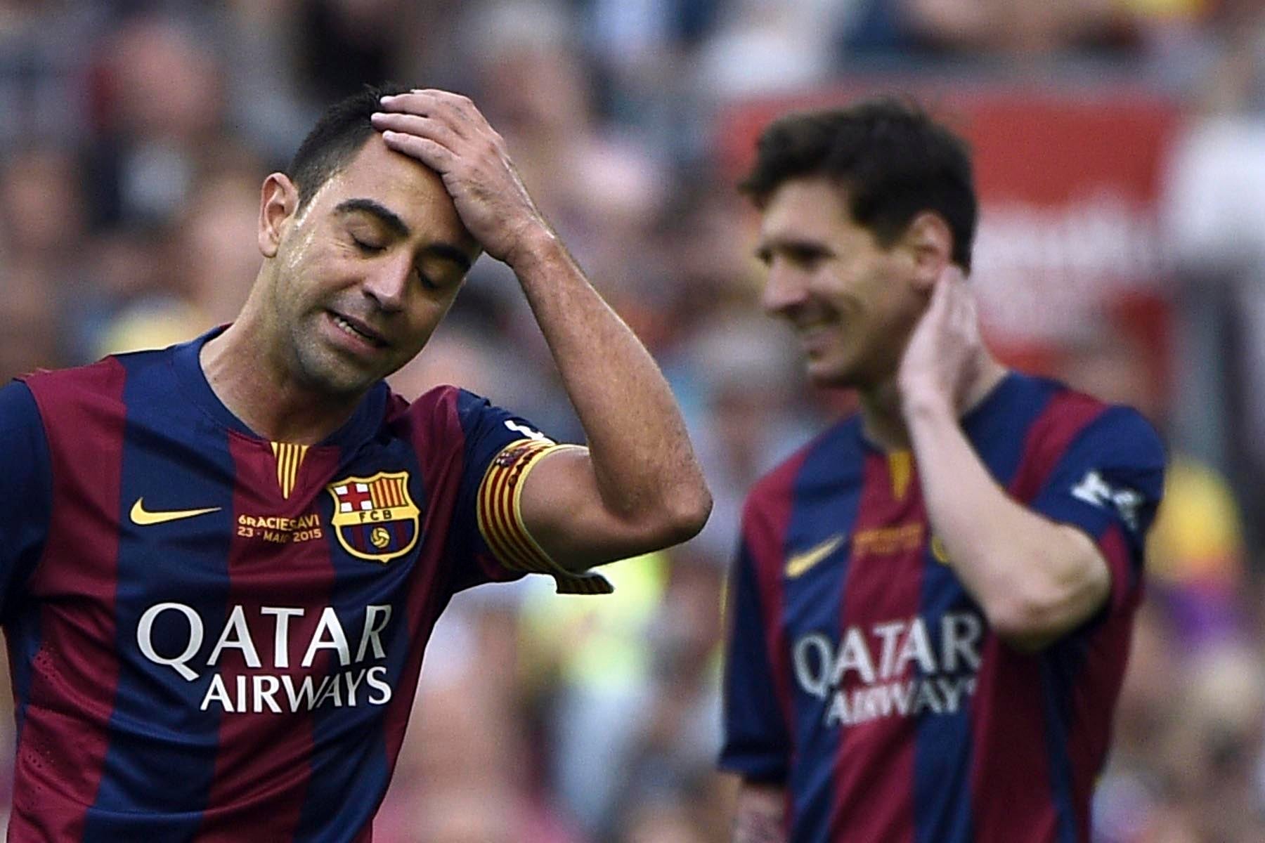 Xavi y Messi durante un partido de 2015