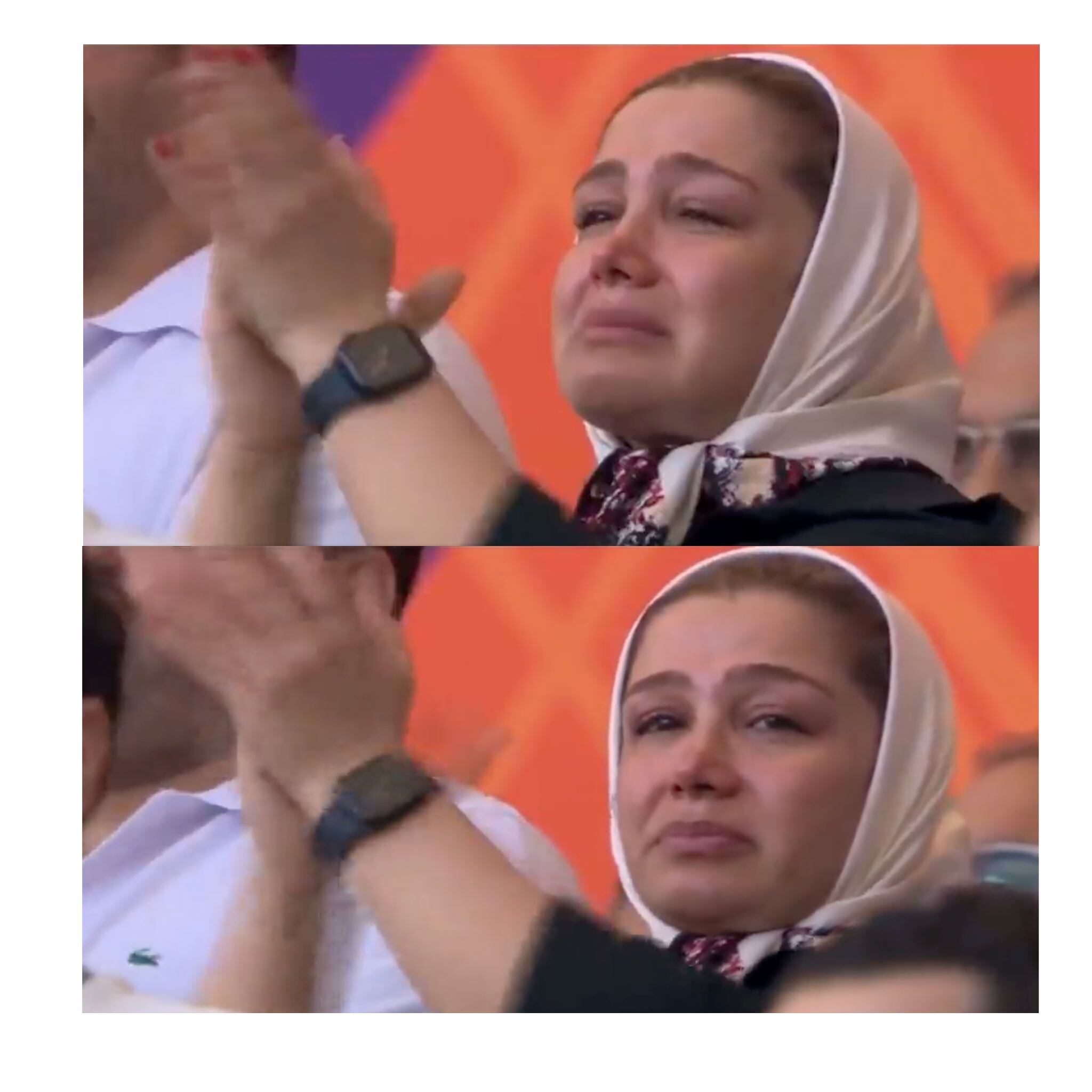 Una mujer de hijab blanco llora emocionada en el primer partido de Irán, cuando los jugadores no cantaron el himno.