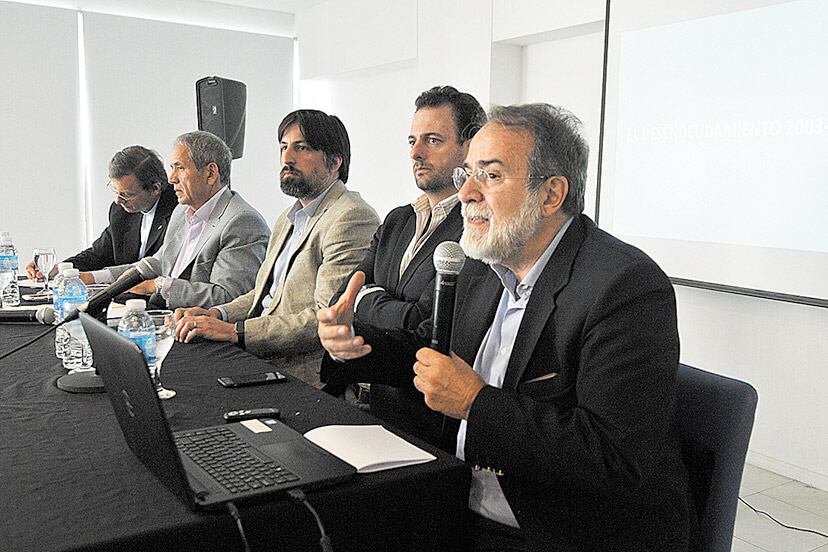 Arnaldo Bocco, José Urtubey y Nicolás Trotta durante la presentación del informe.