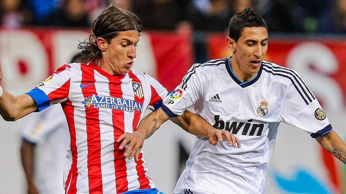 Filipe Luis y Di María en un partido entre Atlético de Madrid y Real Madrid.