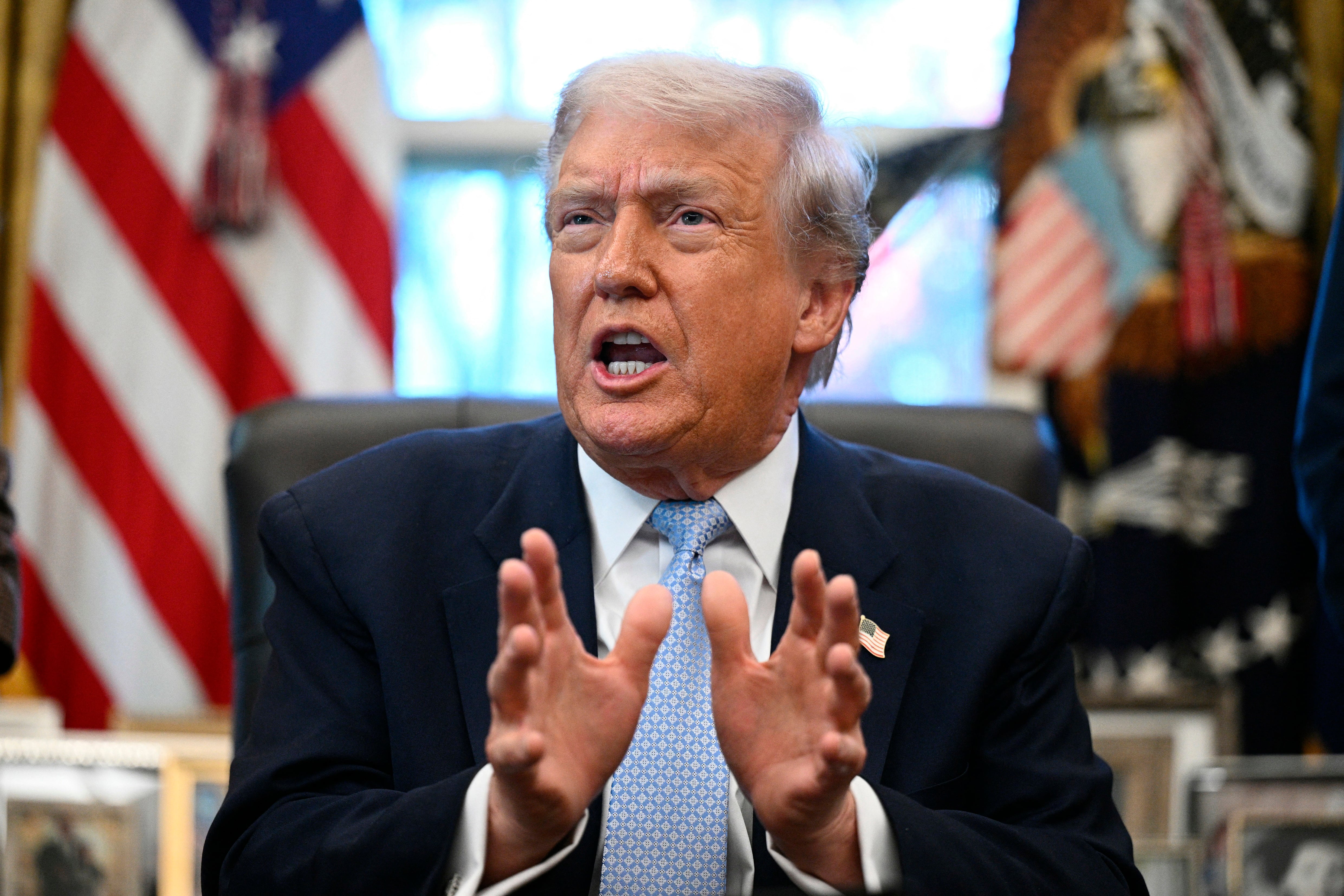 US President Donald Trump speaks during a meeting with the White House Task Force on the FIFA World Cup 2026 in the Oval Office of the White House in Washington, DC on November 17, 2025. (Photo by Brendan SMIALOWSKI / AFP)