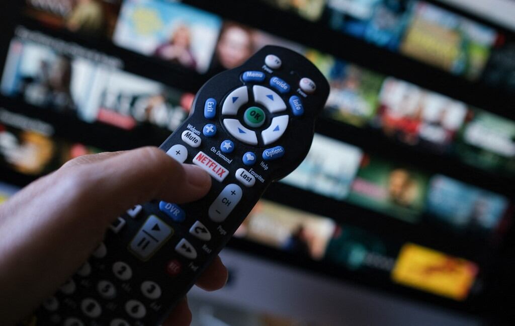 Se reportó que varios equipos están buscando formas de sacar más provecho a los programas y películas más grandes de Netflix.(Foto: AFP).
