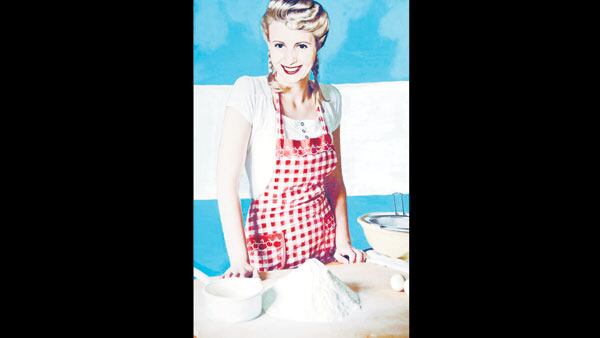 Evita en la cocina en el cuadro Domingo, ñoquis para todos.