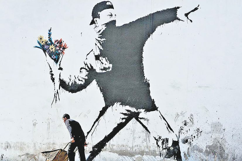 Mural de Banksy en una pared de Palestina.
