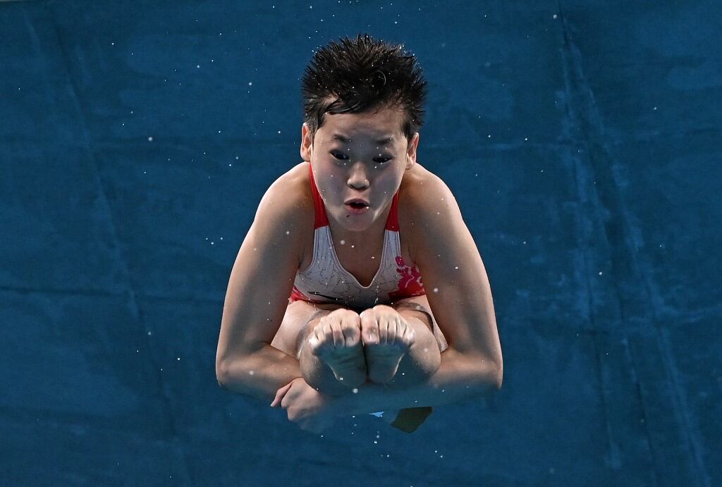 Quan Hongchan en pleno vuelo hacia la perfección