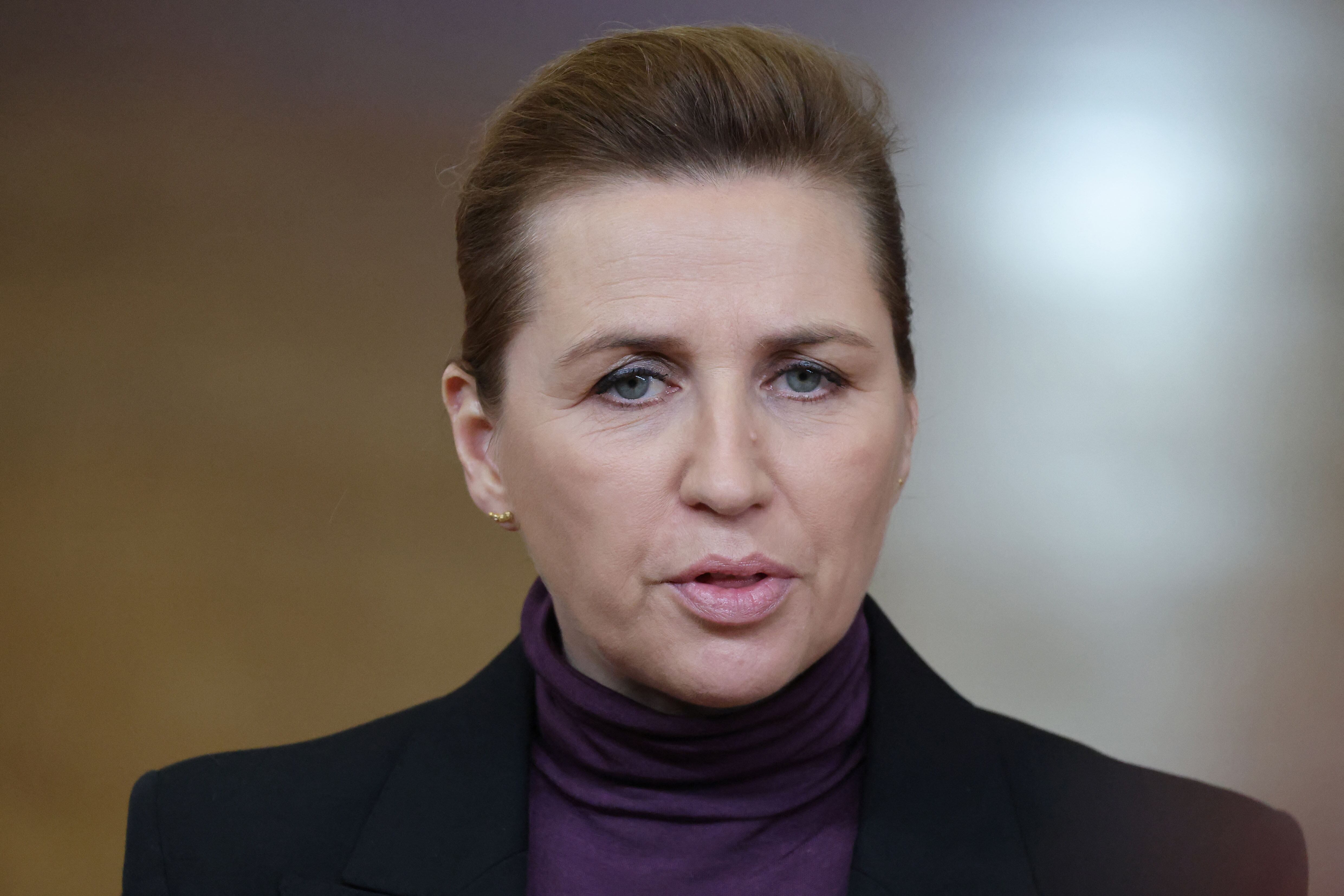 Denmark's Prime Minister Mette Frederiksen speaks to the press as she arrives for a European Council meeting to discuss recent developments in transatlantic relations, in Brussels, on January 22, 2026. EU leaders meet on January 22, 2026, for an emergency summit on threats by US President to impose tariffs on countries opposed to his push to take Greenland, with crisis talks in Brussels coming to weigh potential countermeasures against the United States. (Photo by Ludovic MARIN / AFP)