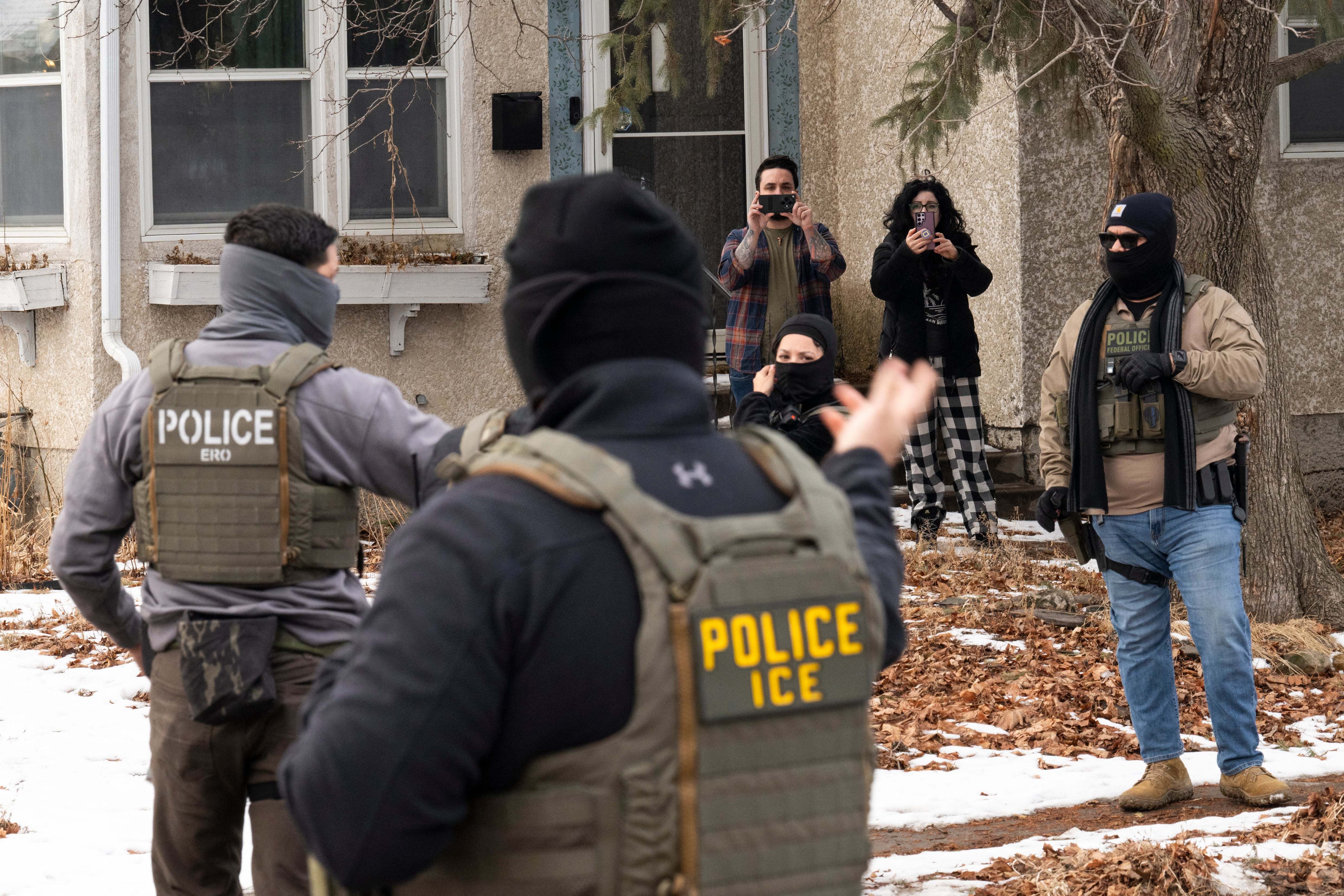 MINNEAPOLIS, MINNESOTA - FEBRUARY 05: Observers film ICE agents as they hold a perimeter after one of their vehicles got a flat tire on Penn Avenue on February 5, 2026 in Minneapolis, Minnesota. Protests continue calling for an end to immigration raids in the Twin cities which have already resulted in the fatal shooting deaths of Alex Pretti, a VA nurse, and Renee Good, a mother of three, by federal agents. Stephen Maturen/Getty Images/AFP (Photo by Stephen Maturen / GETTY IMAGES NORTH AMERICA / Getty Images via AFP)