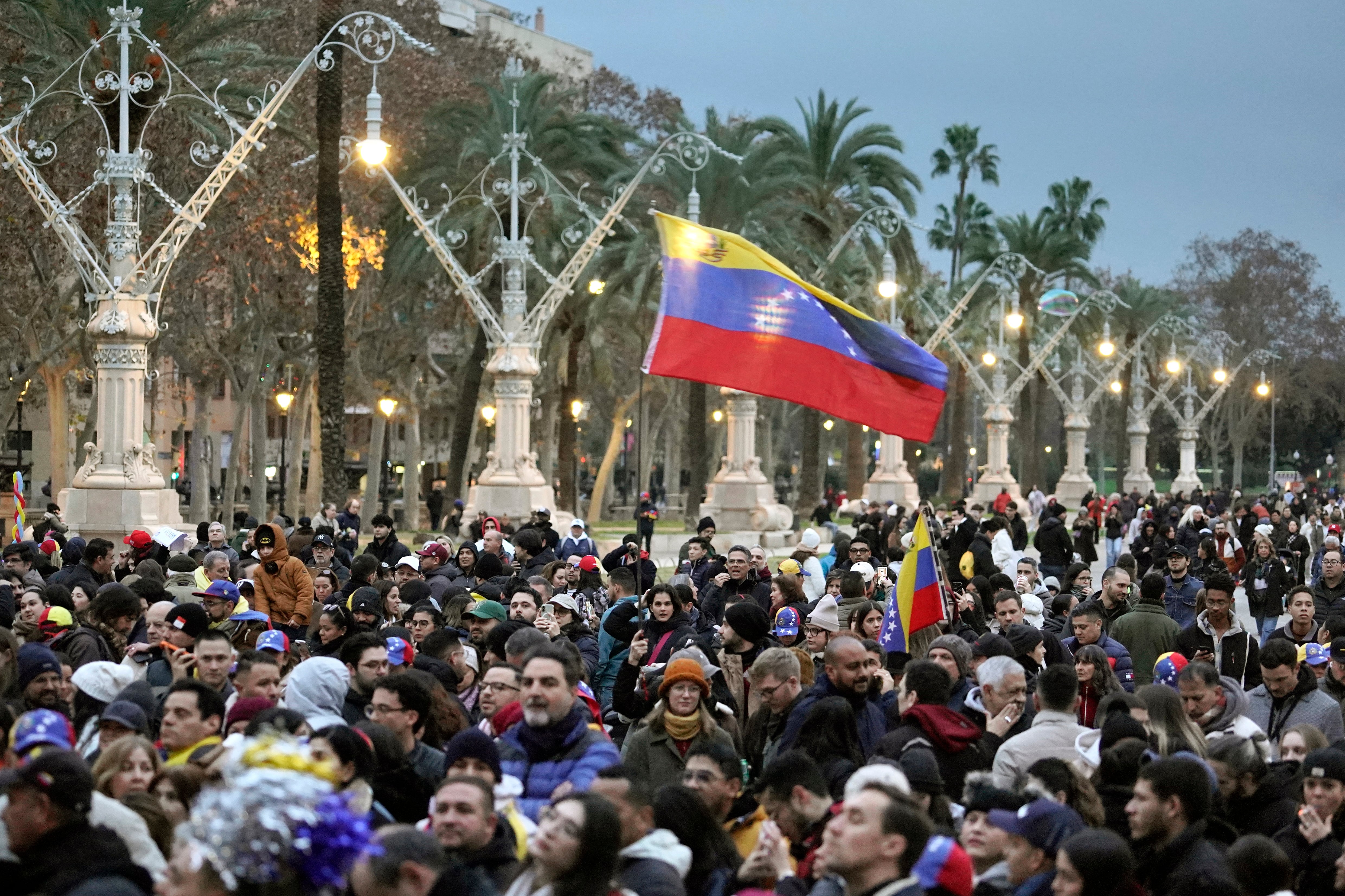 Protesters take part in a demonstration in support of the Venezuelan people following the US military operation in Venezuela to capture the Venezuelan president, in Barcelona on January 4, 2026. Venezuela's president Nicolas Maduro was in a New York jail today after a shock US snatch-and-grab raid to remove him from power and assert Washington's control over the oil-rich South American nation. (Photo by Manaure Quintero / AFP)