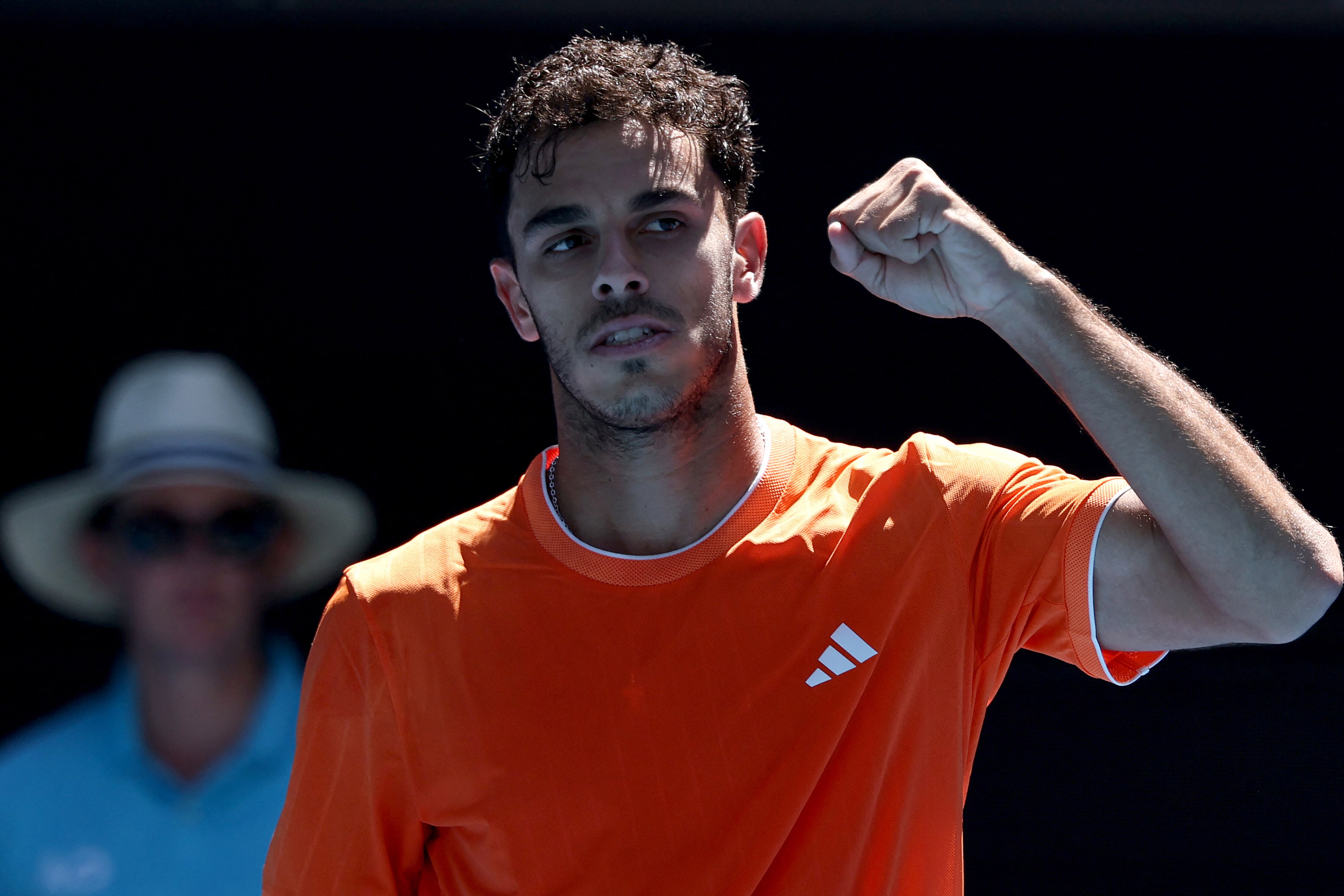 Argentina’s Francisco Cerundolo celebrates victory against China's Zhang Zhizhen after their men's singles match on day one of the Australian Open tennis tournament in Melbourne on January 18, 2026. (Photo by DAVID GRAY / AFP) / -- IMAGE RESTRICTED TO EDITORIAL USE - STRICTLY NO COMMERCIAL USE --