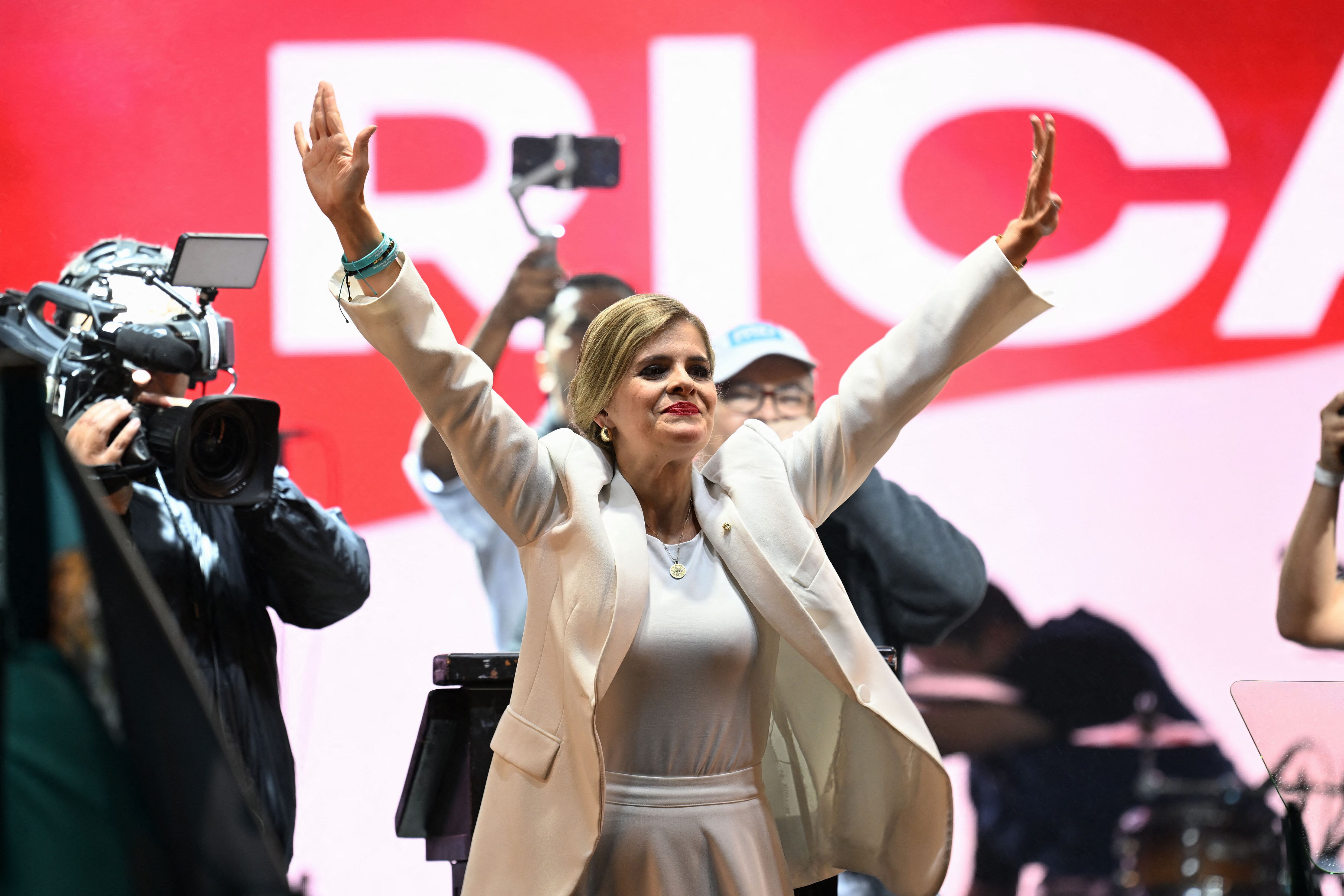 Costa Rica’s presidential candidate from the Sovereign People Party, Laura Fernandez, waves to supporters during her victory speech after the presidential election results at the Aurola Hotel, in San Jose on February 1, 2026. Right-wing candidate Laura Fernandez won Costa Rica's presidential election on February 1 by a landslide after promising to crack down hard on rising violence linked to the cocaine trade. (Photo by MARVIN RECINOS / AFP)