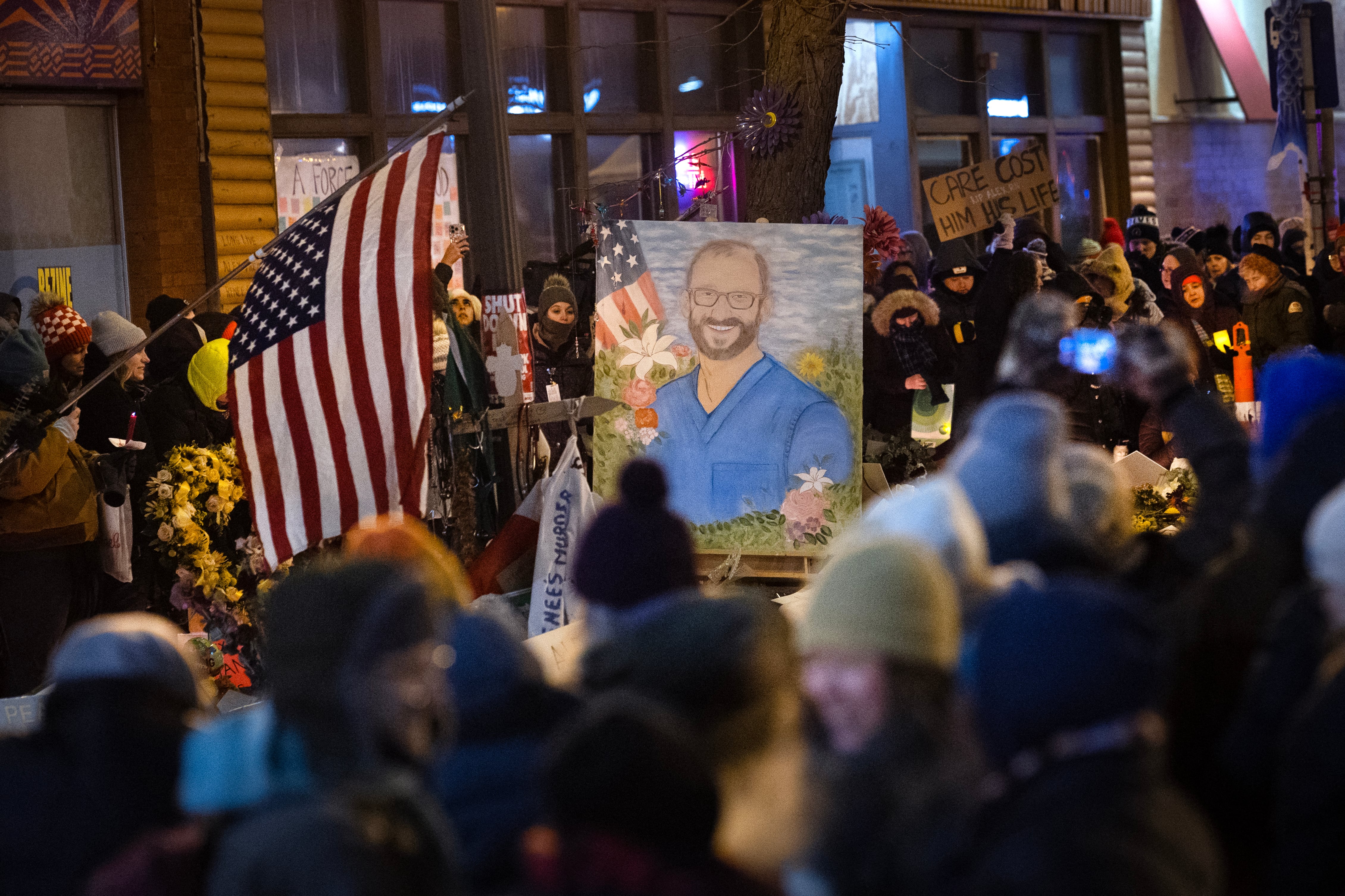 MINNEAPOLIS, MINNESOTA - JANUARY 28: People attend a candlelight vigil organized by healthcare workers at the site where Alex Pretti was killed on January 28, 2026 in Minneapolis, Minnesota. The vigil was held to remember the lives of Pretti, a 37-year-old ICU nurse at a VA medical center who died January 24, after being shot multiple times during a brief altercation with border patrol agents, and Renee Good a 37-year-old mother of three children who was killed by ICE agents on January 7. Scott Olson/Getty Images/AFP (Photo by SCOTT OLSON / GETTY IMAGES NORTH AMERICA / Getty Images via AFP)