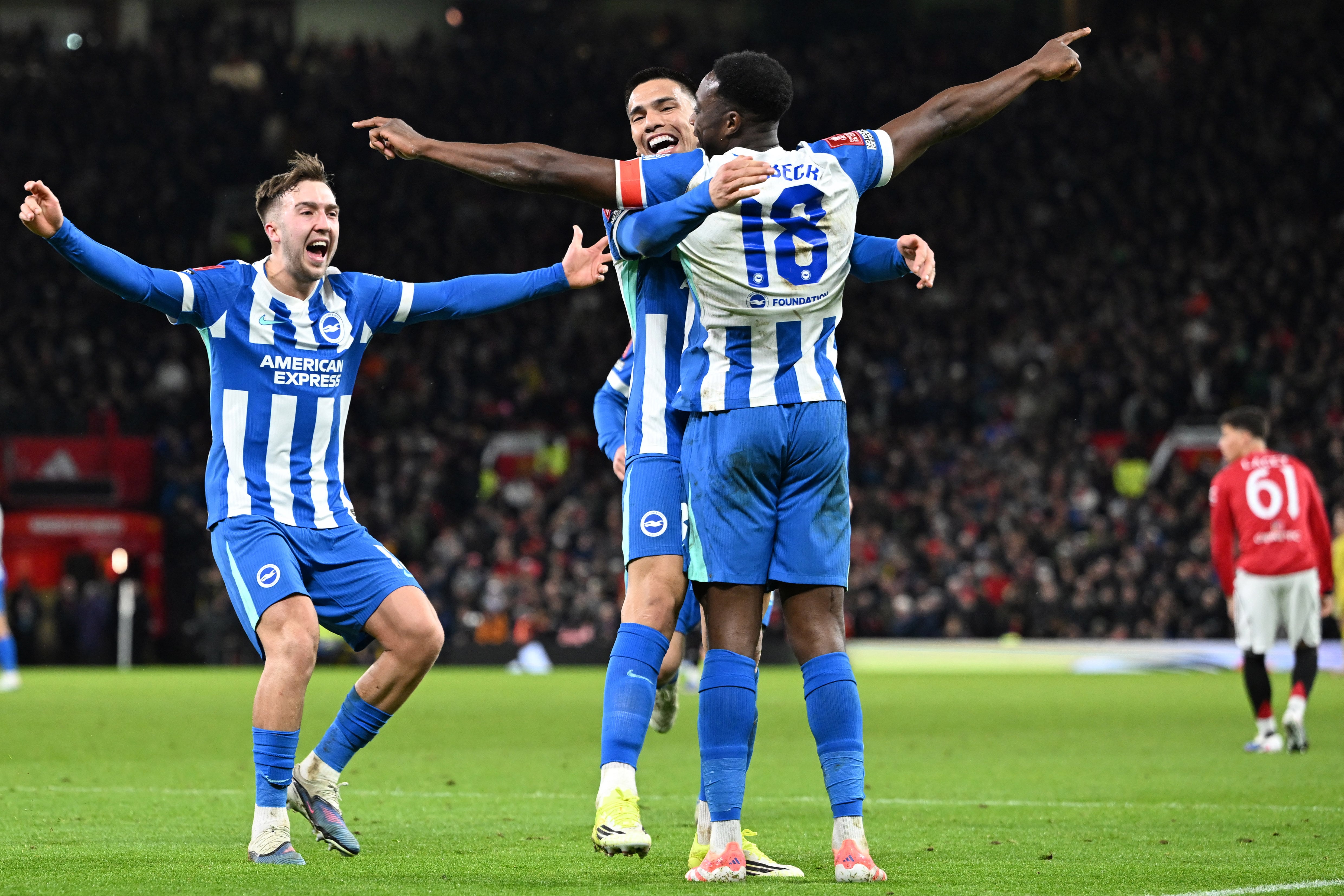 Brighton's English striker #18 Danny Welbeck celebrates with teammates after scoring their second goal during the English FA Cup third round football match between Manchester United and Brighton and Hove Albion at Old Trafford Stadium in Manchester, north west England, on January 11, 2026. (Photo by PETER POWELL / AFP) / RESTRICTED TO EDITORIAL USE. NO USE WITH UNAUTHORIZED AUDIO, VIDEO, DATA, FIXTURE LISTS, CLUB/LEAGUE LOGOS OR 'LIVE' SERVICES. ONLINE IN-MATCH USE LIMITED TO 120 IMAGES. AN ADDITIONAL 40 IMAGES MAY BE USED IN EXTRA TIME. NO VIDEO EMULATION. SOCIAL MEDIA IN-MATCH USE LIMITED TO 120 IMAGES. AN ADDITIONAL 40 IMAGES MAY BE USED IN EXTRA TIME. NO USE IN BETTING PUBLICATIONS, GAMES OR SINGLE CLUB/LEAGUE/PLAYER PUBLICATIONS. /