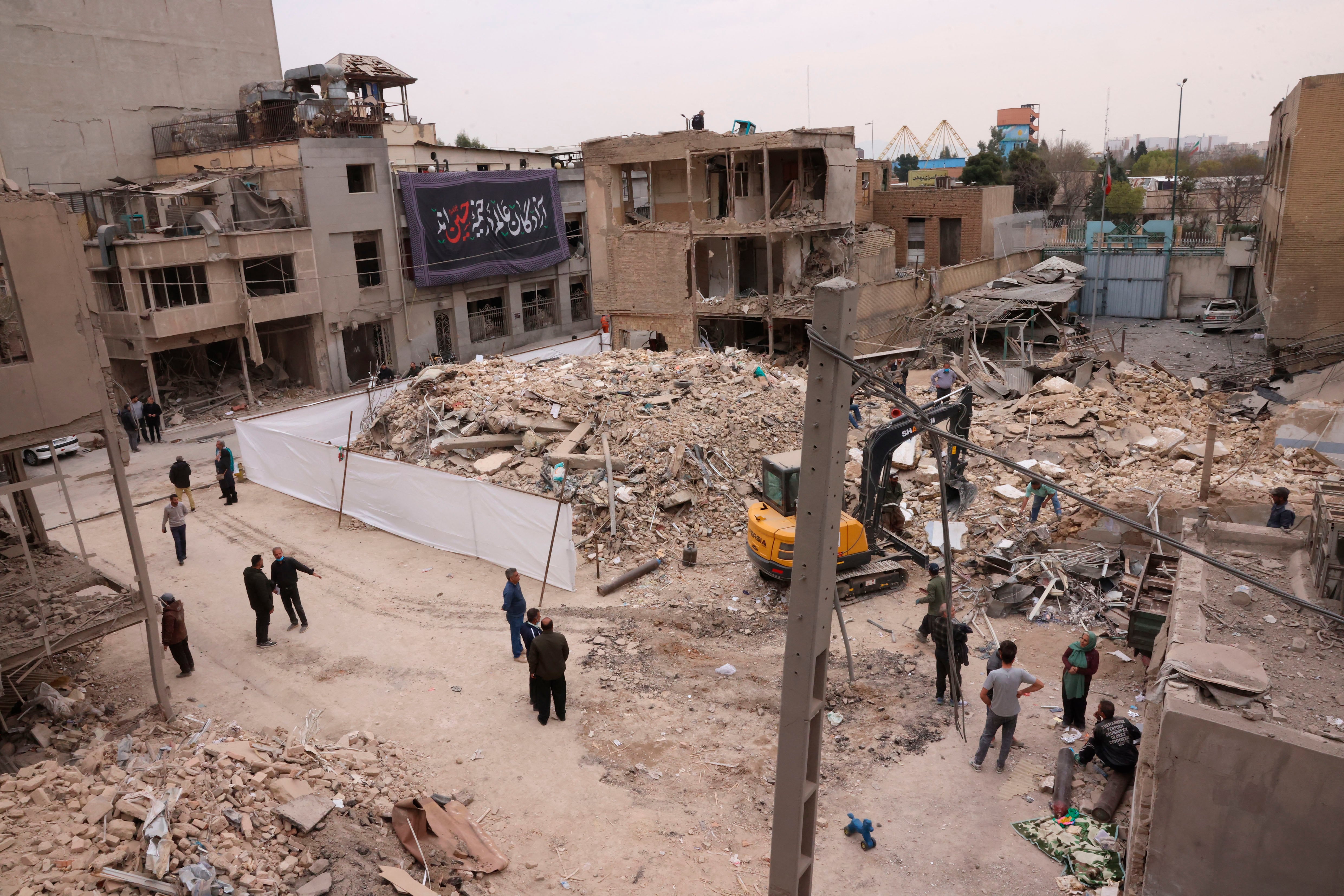 A view of a damaged residential neighbourhood following a military strike on the Iranian capital Tehran on March 15, 2026. Iran's Foreign Minister said in an interview published on March 15, that the war pitting his country against the United States and Israel will only end when Tehran can be certain it will not be restarted. On February 28, Israel and the United States launched strikes on Iran, killing its supreme leader Ayatollah and triggering a war that spread across the Middle East. (Photo by Atta KENARE / AFP)
