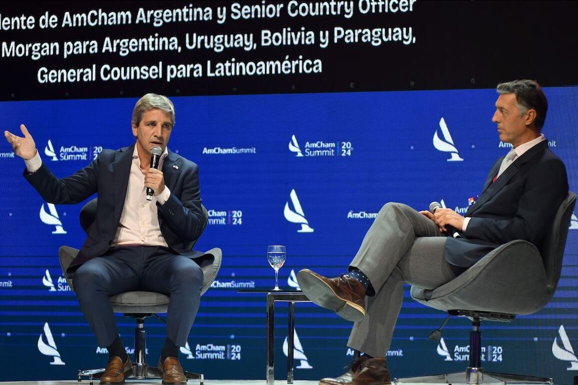 Dos viejos conocidos. Gómez Minujin, jefe del Morgan, y el ministro Caputo, ex