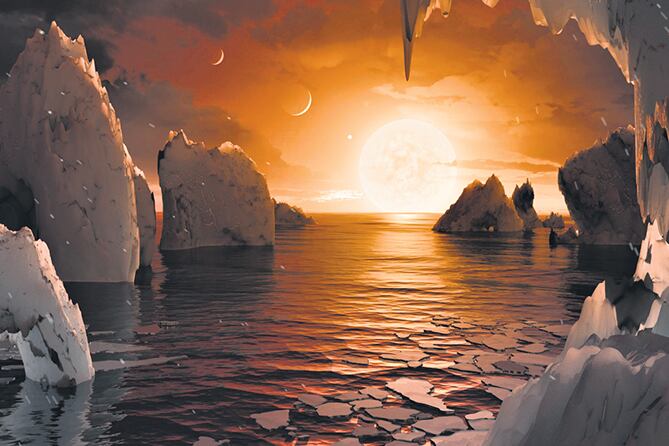 Uno de los planetas, el Trappist-1f, tal como lo imagina la NASA, con océanos y zonas tal vez habitables.