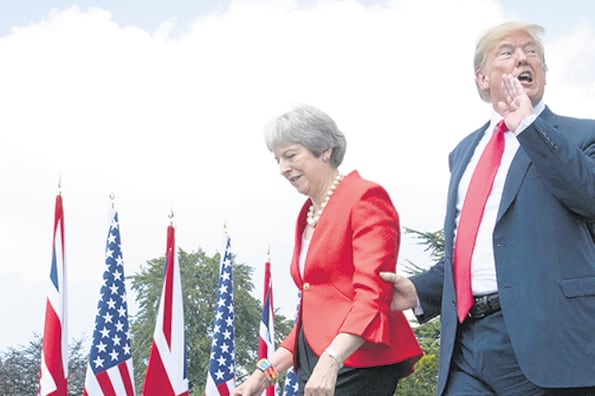 May recibió a Trump en medio de un revuelo por unas declaraciones previas del mandatario estadounidense.
