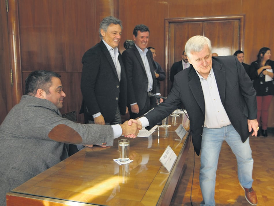 El ministro de Trabajo, Jorge Triaca, y el titular de la UOM, Antonio Caló.