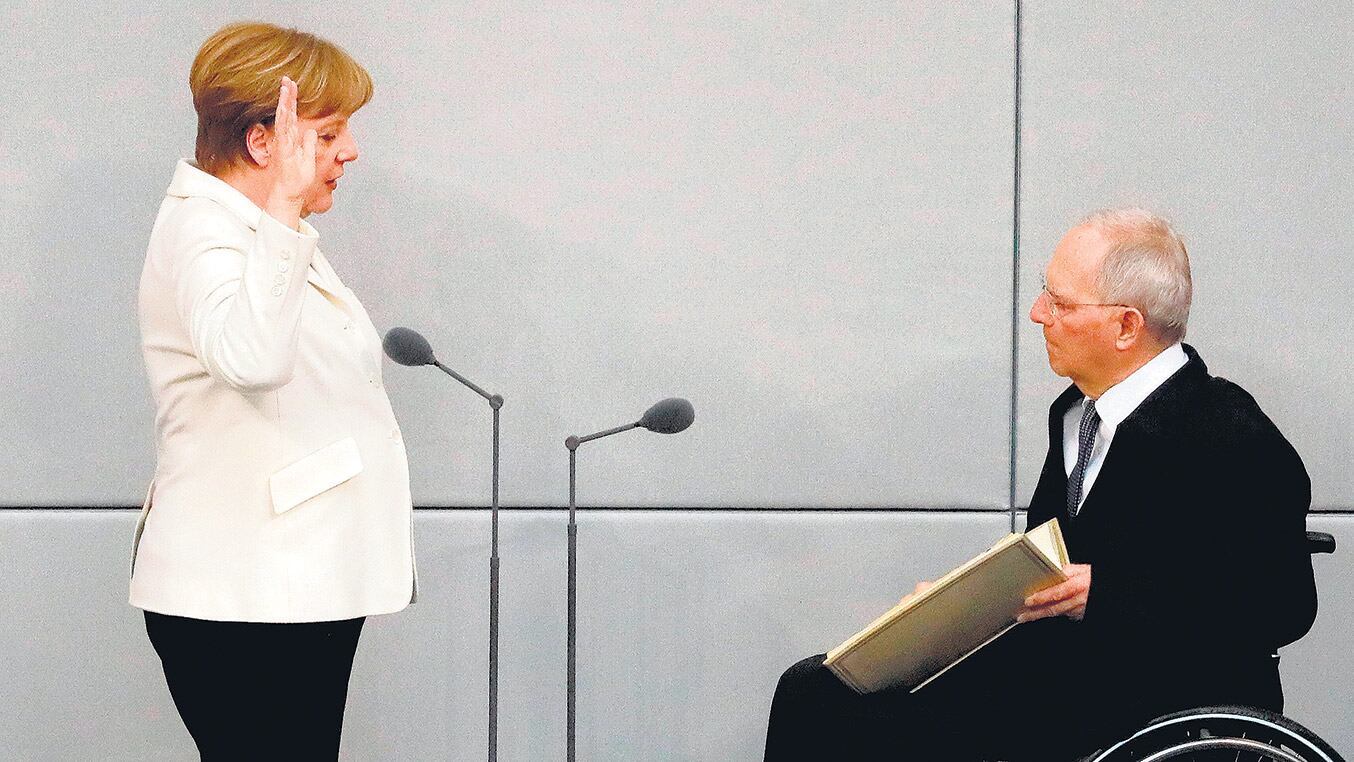 Merkel fue investida ayer como canciller en la Cámara baja alemana.