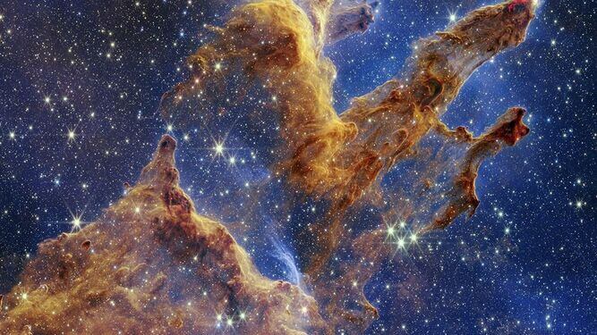 La nueva imagen permite ver a través de la opacidad de los pilares, revelando la formación de muchas estrellas nuevas. (Foto: NASA/ESA/CSA/AFP)