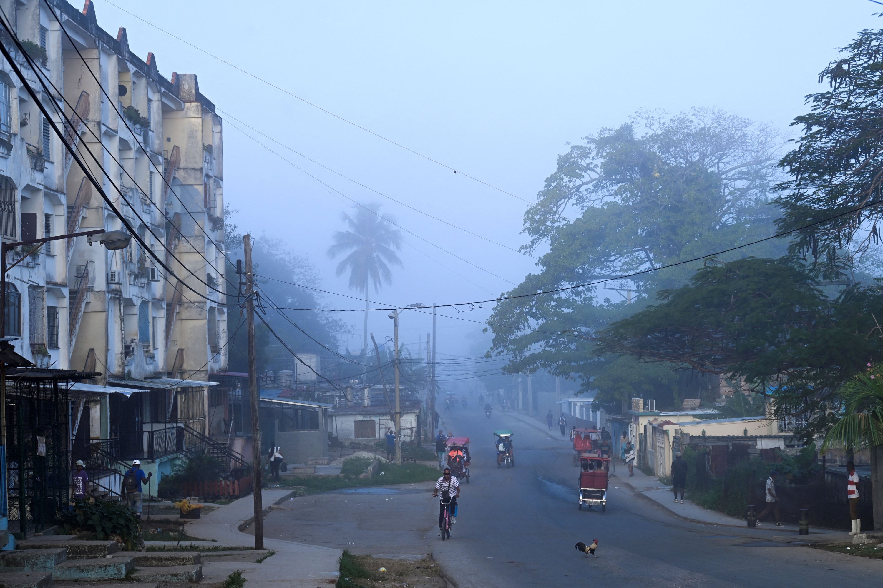 View of a street at La Guinera neighborhood in Havana on March 13, 2026. Cuba's President Miguel Diaz-Canel confirmed on March 13, 2026 that “Cuban officials have recently held talks” with representatives of the United States, amid heightened tensions between Washington and Havana. (Photo by YAMIL LAGE / AFP)
