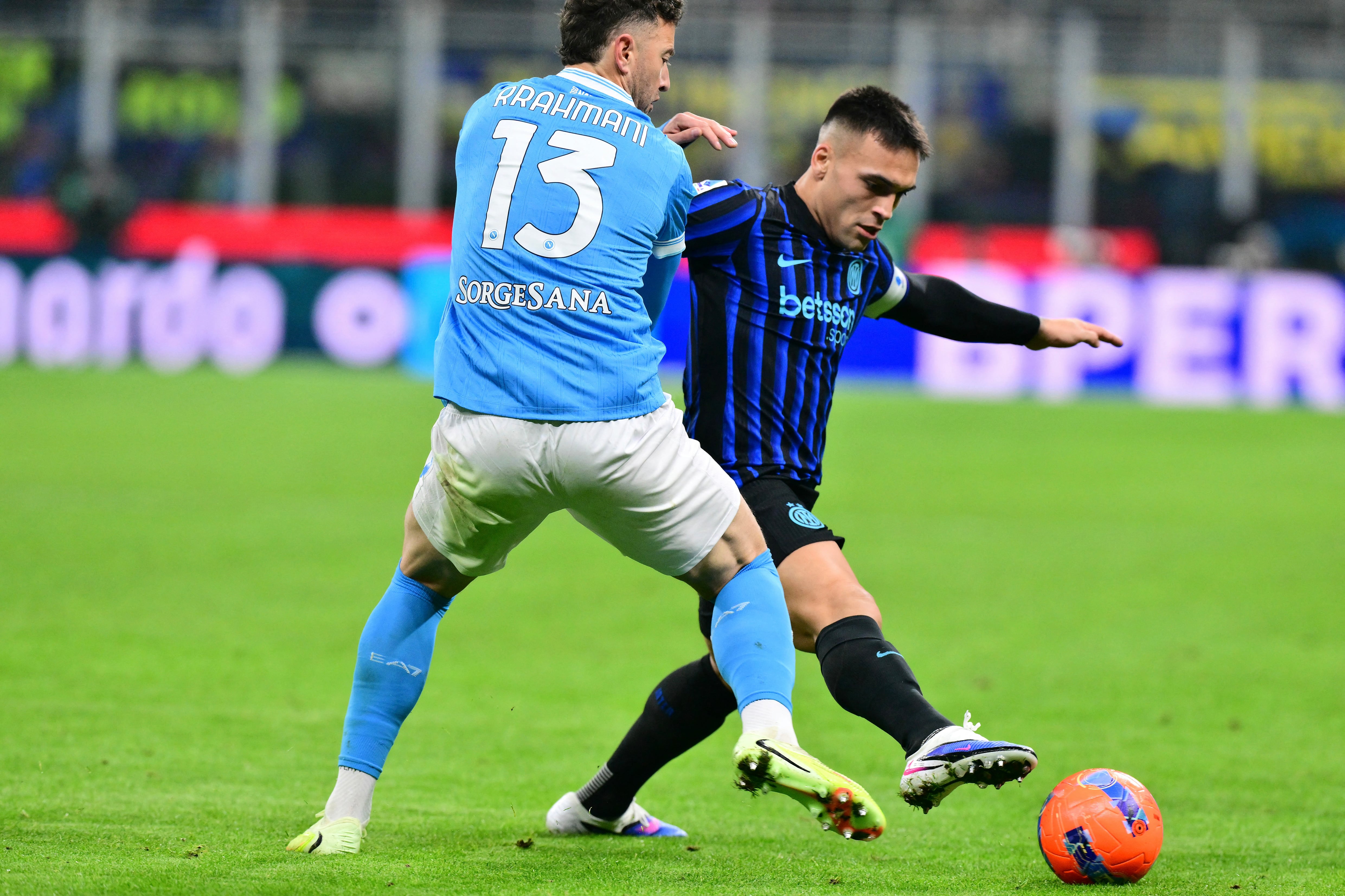Inter Milan's Argentinian forward #10 Lautaro Martinez (R) fights for the ball with Napoli's Kosovo defender #13 Amir Rrahmani (L) during the Italian Serie A football match between Inter Milan and Napoli at San Siro stadium in Milan, on January 11, 2026. (Photo by Stefano RELLANDINI / AFP)